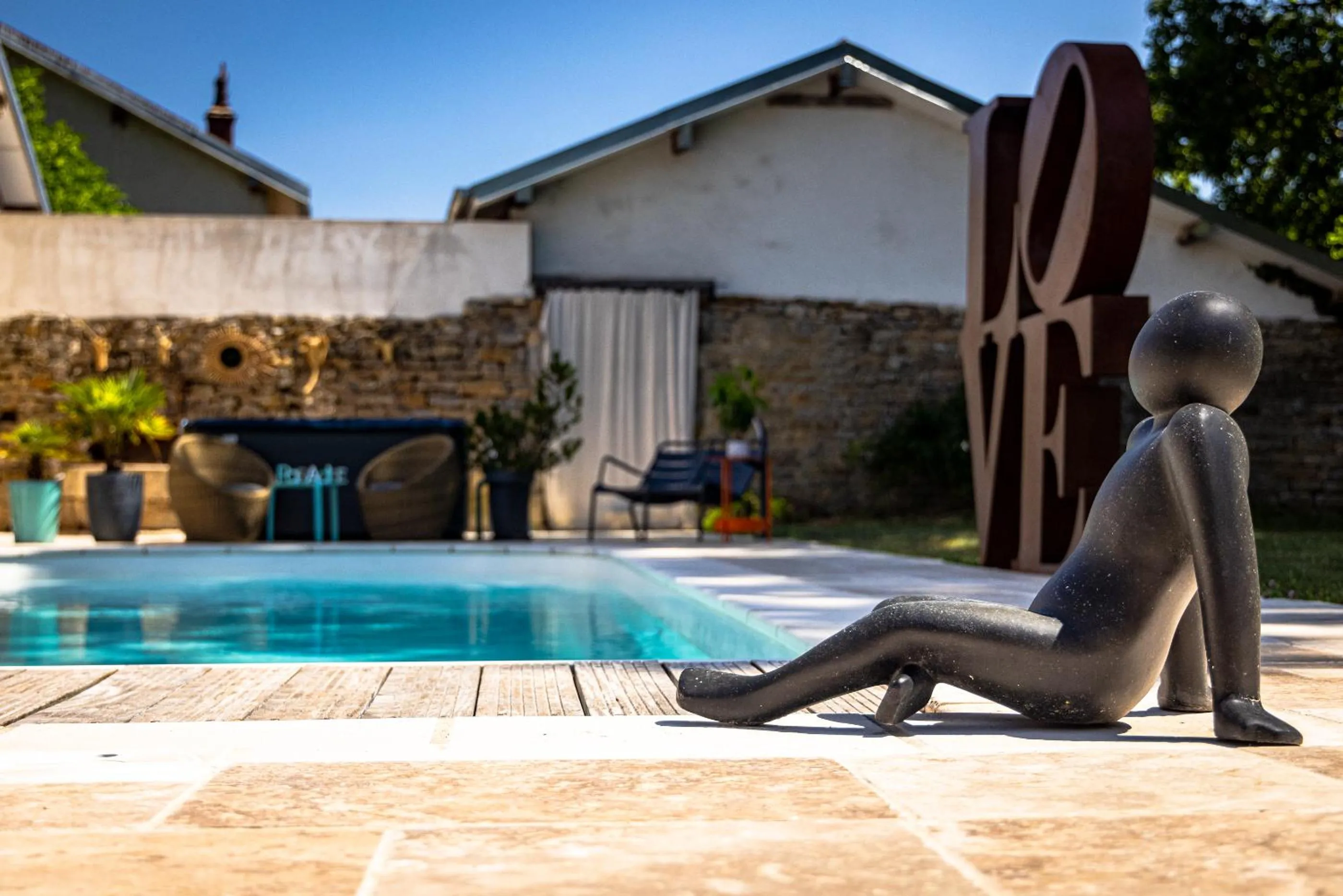 Swimming pool in Le 49 Côté Parc & SPA