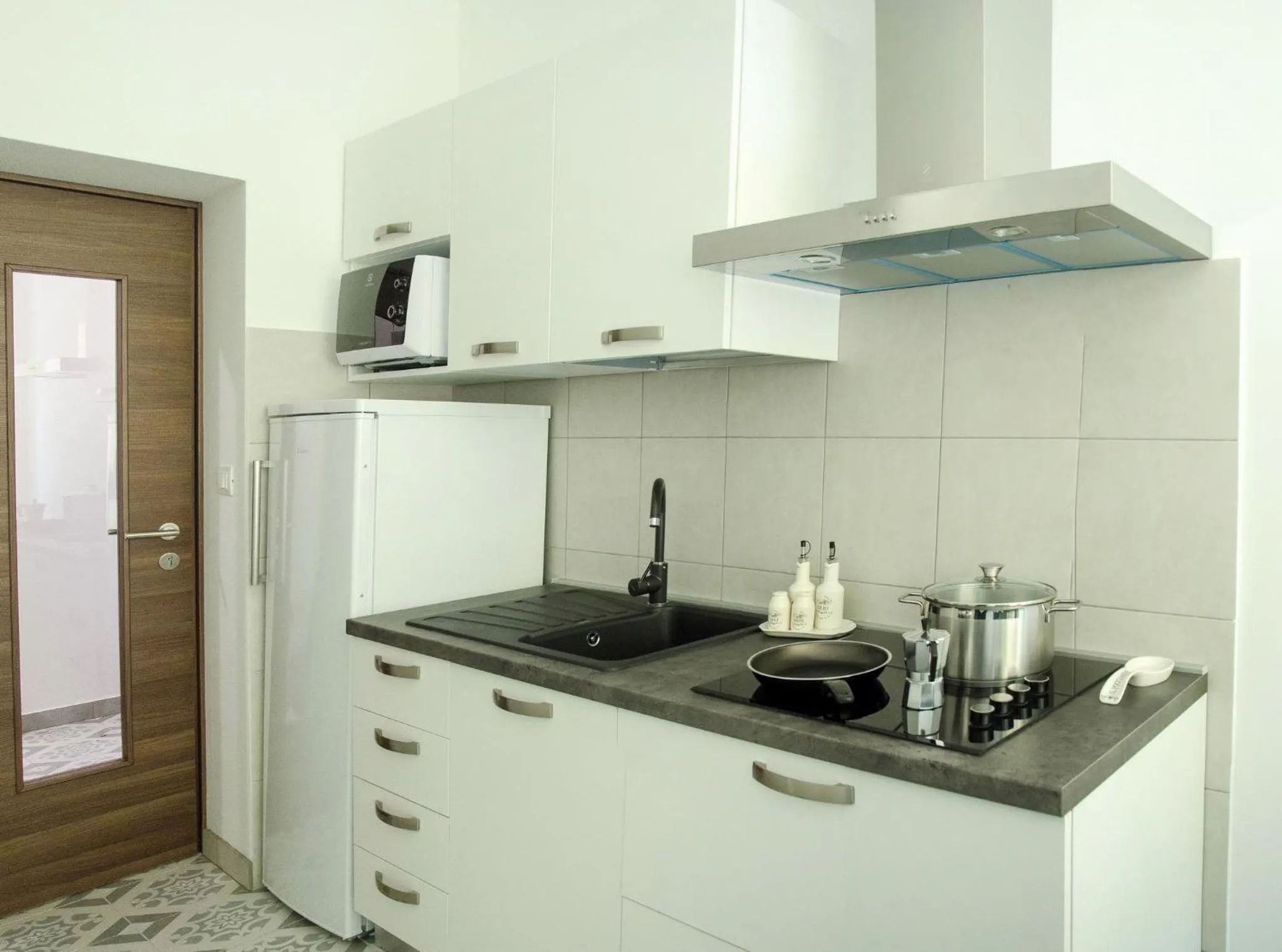 Communal kitchen in San Martino Rooms