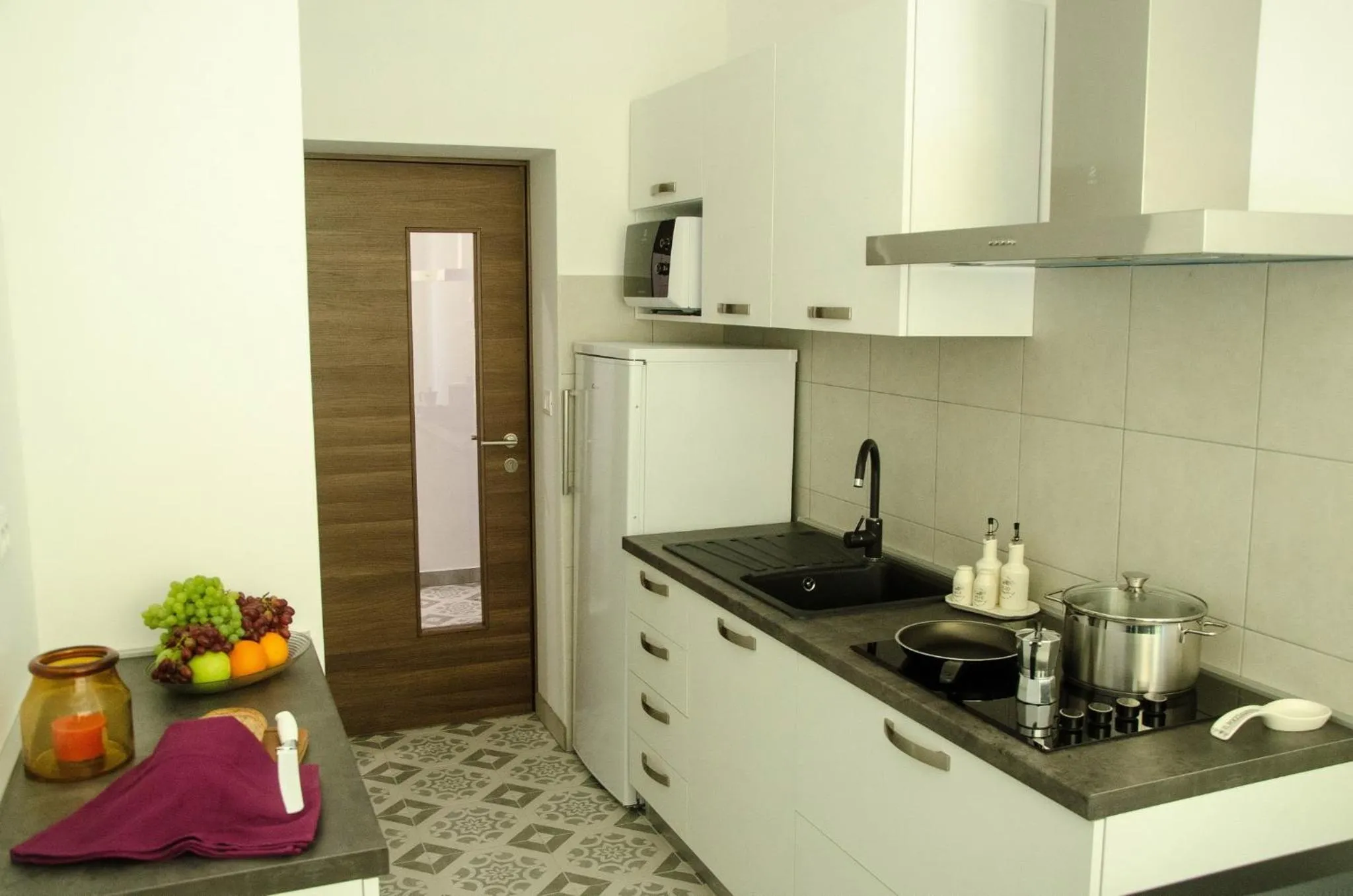 Communal kitchen in San Martino Rooms