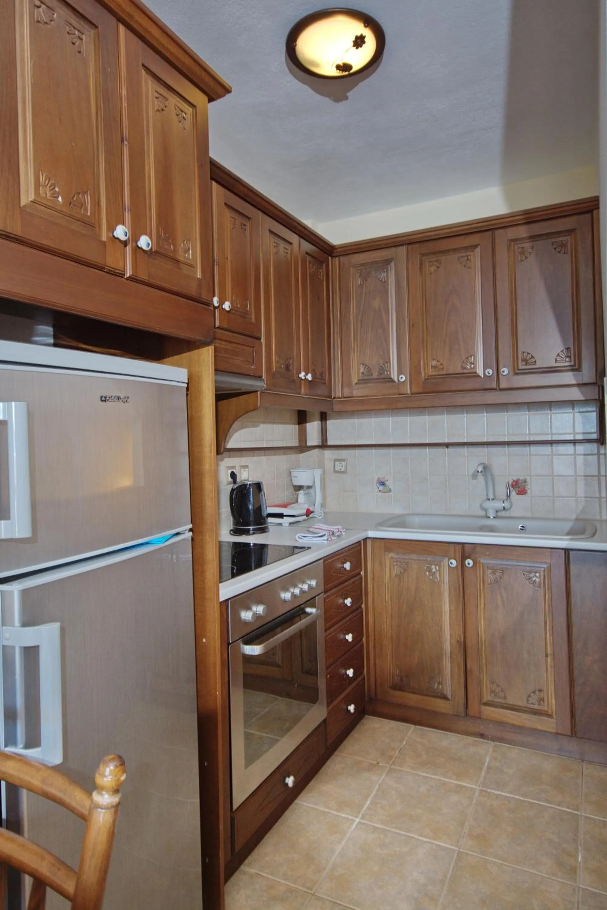 Kitchen or kitchenette in Pelagos Villas