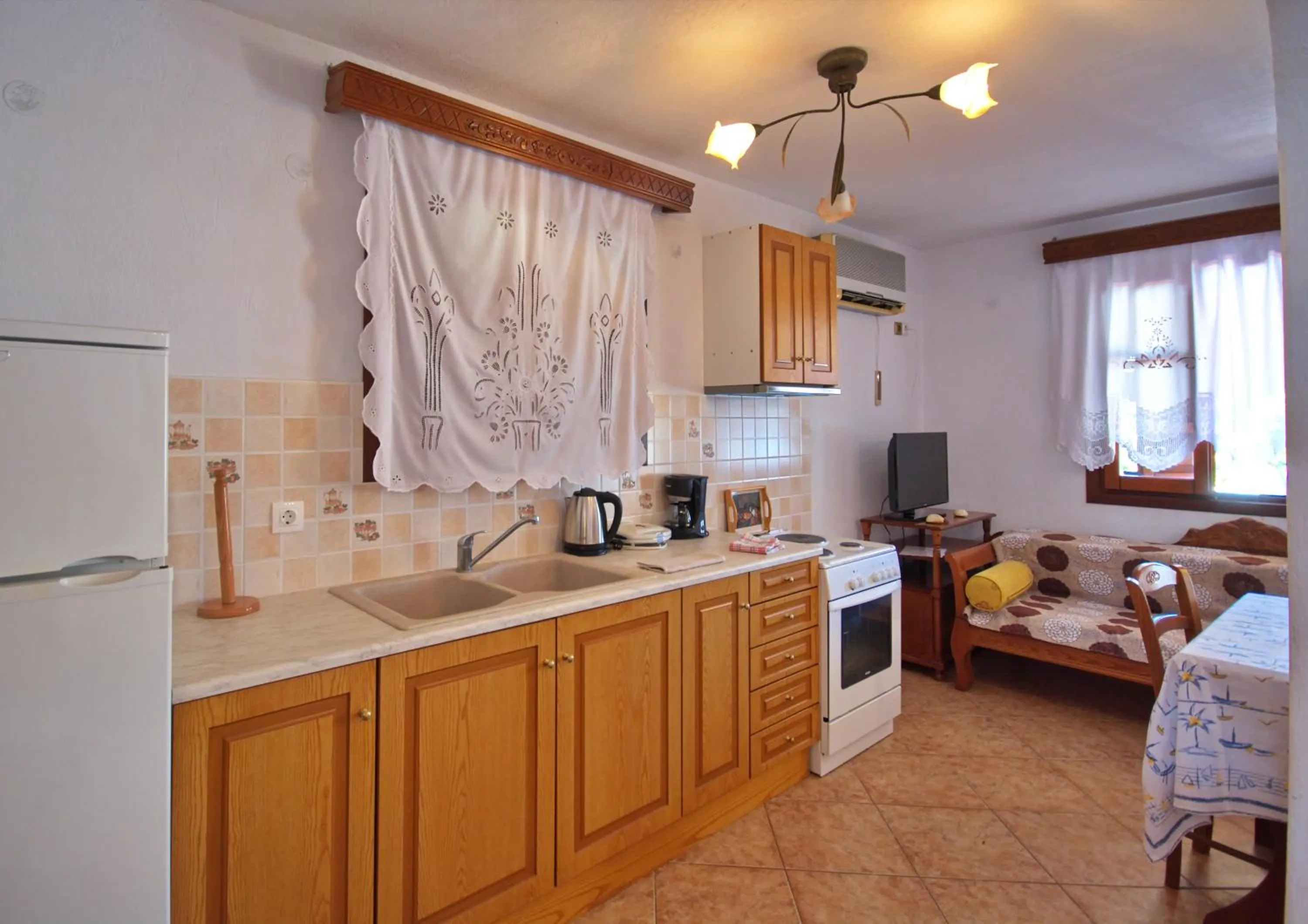 Kitchen or kitchenette in Pelagos Villas