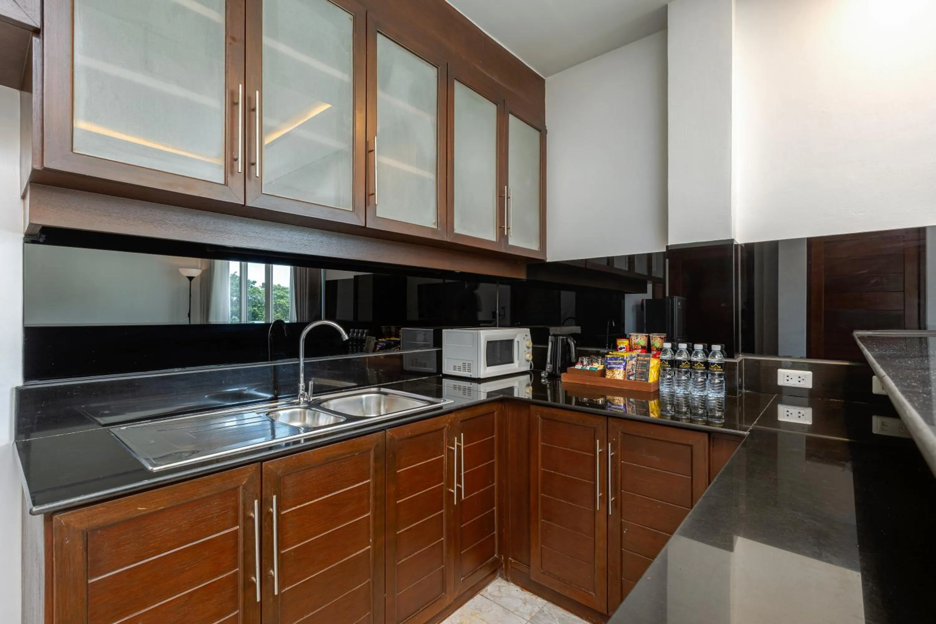 Kitchen or kitchenette in Phunawa Resort Phuket Karon Beach - SHA Plus