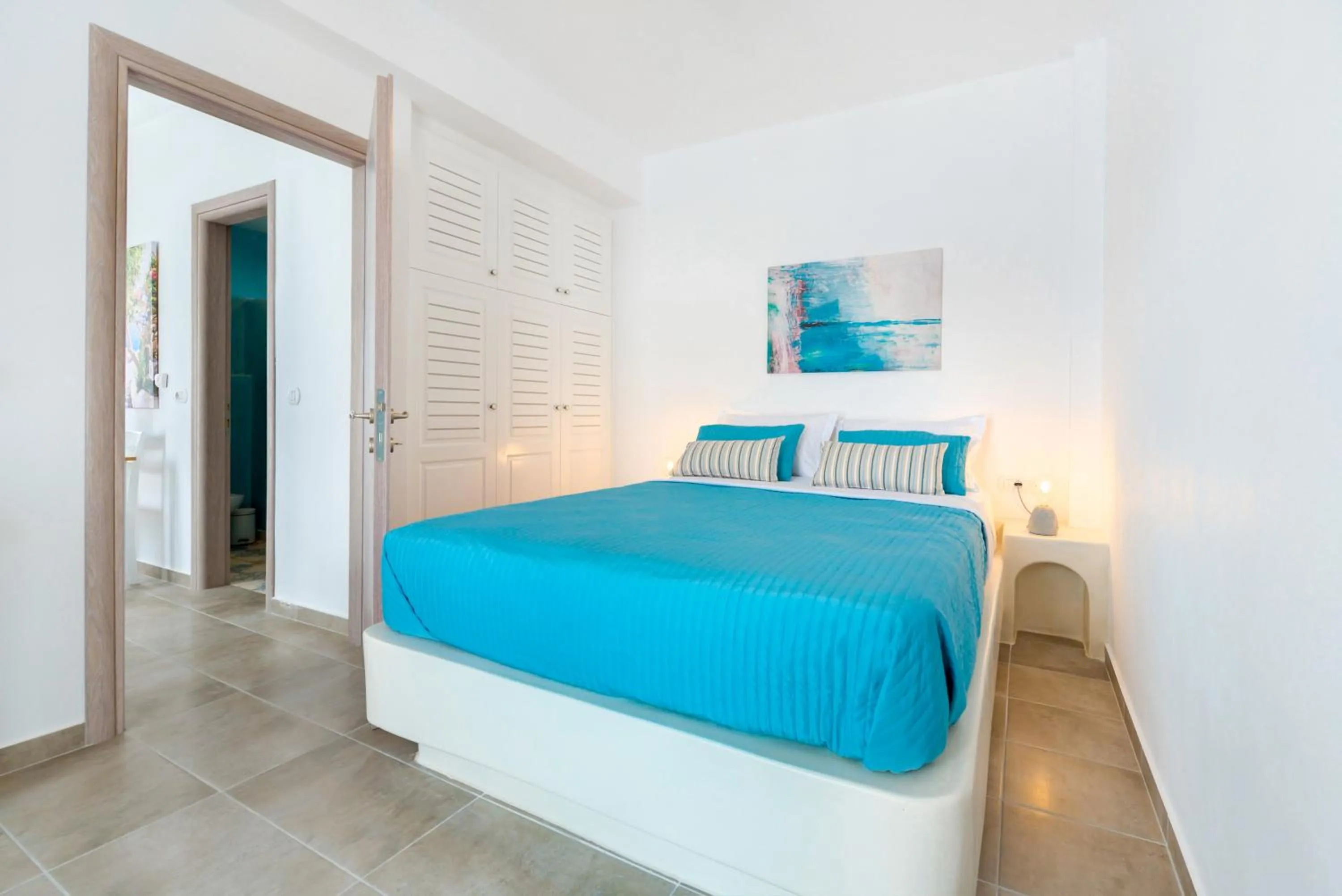 Bed in White Harmony Suites