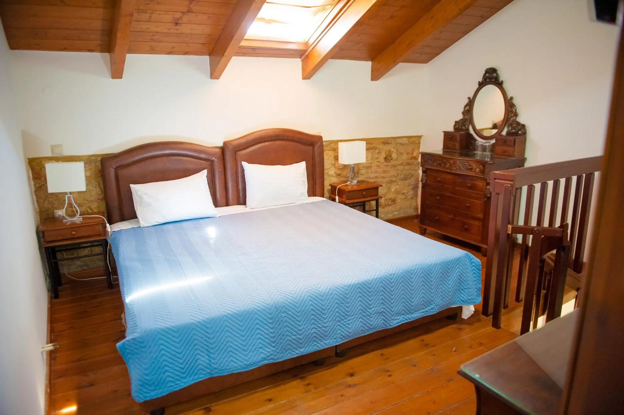 Photo of the whole room, Bed in SeaFront Stone Suites
