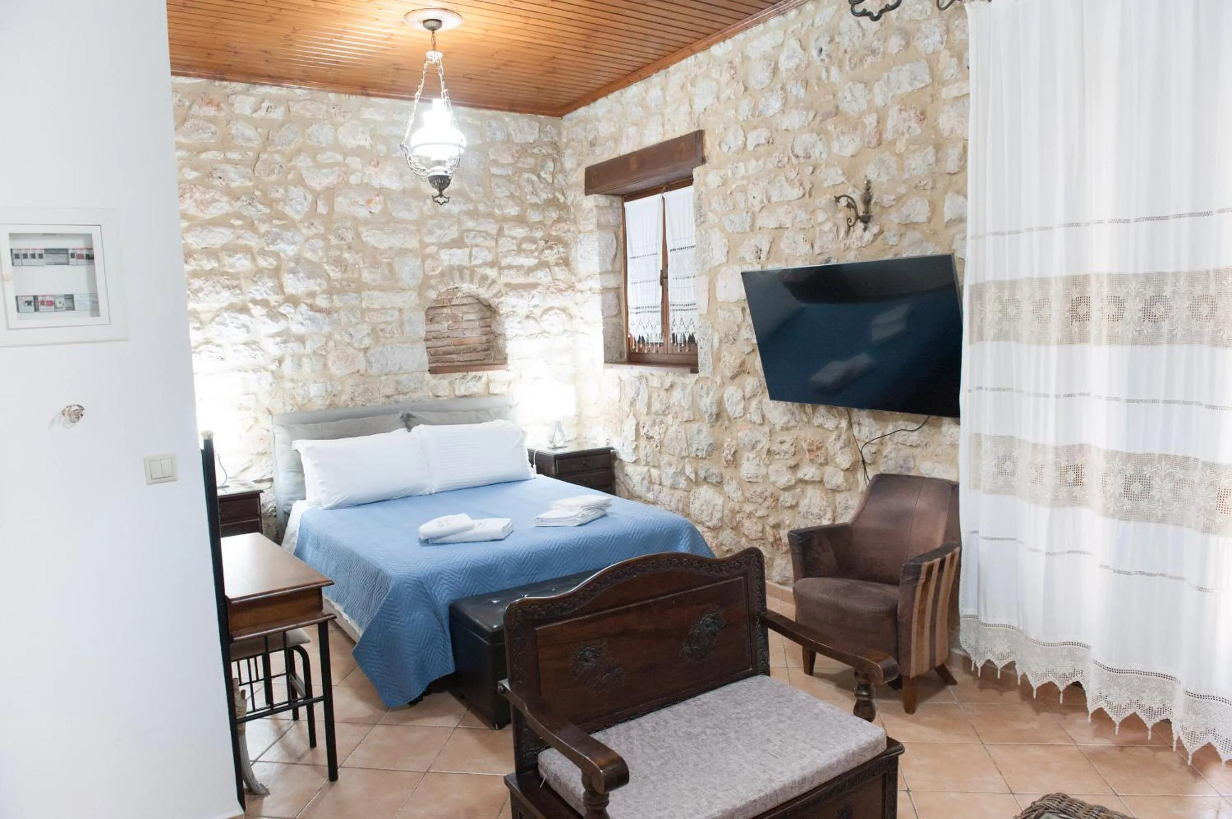 Photo of the whole room, Bed in SeaFront Stone Suites