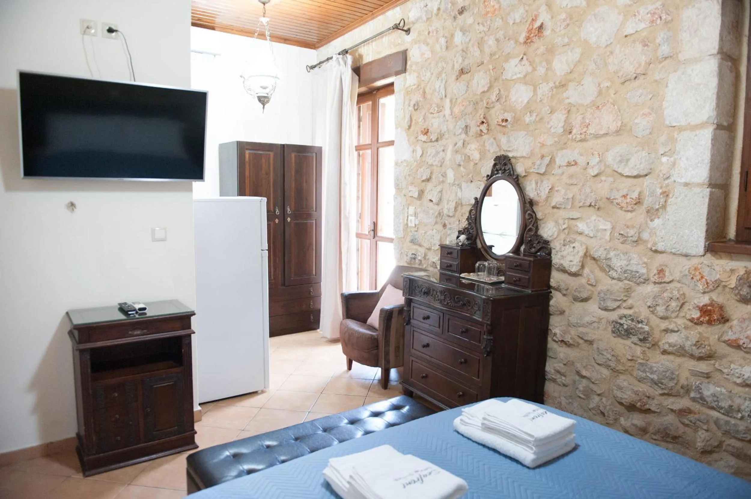 Photo of the whole room, Bed in SeaFront Stone Suites