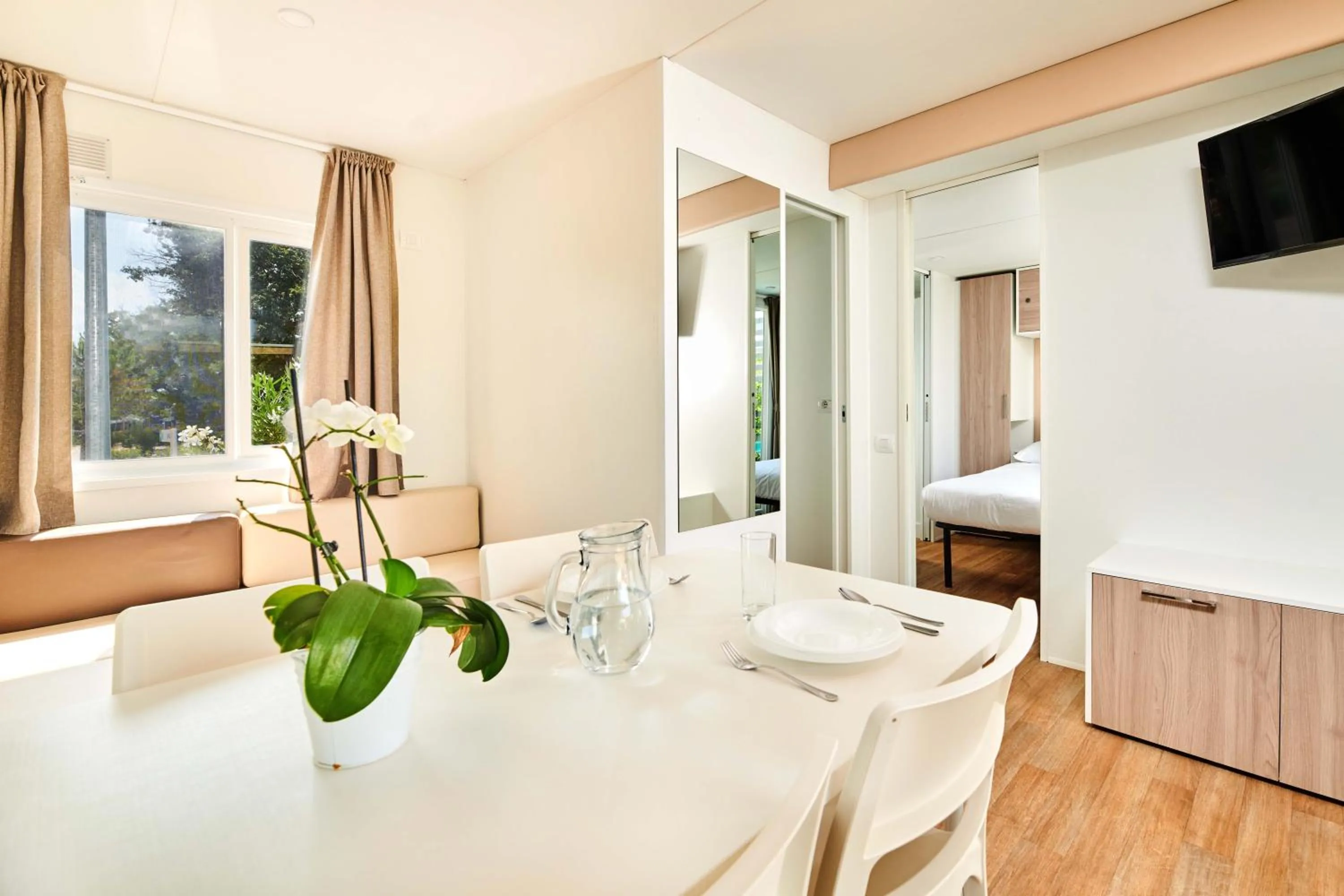 Dining area, Bed in Camping Stella Maris Mobile Homes