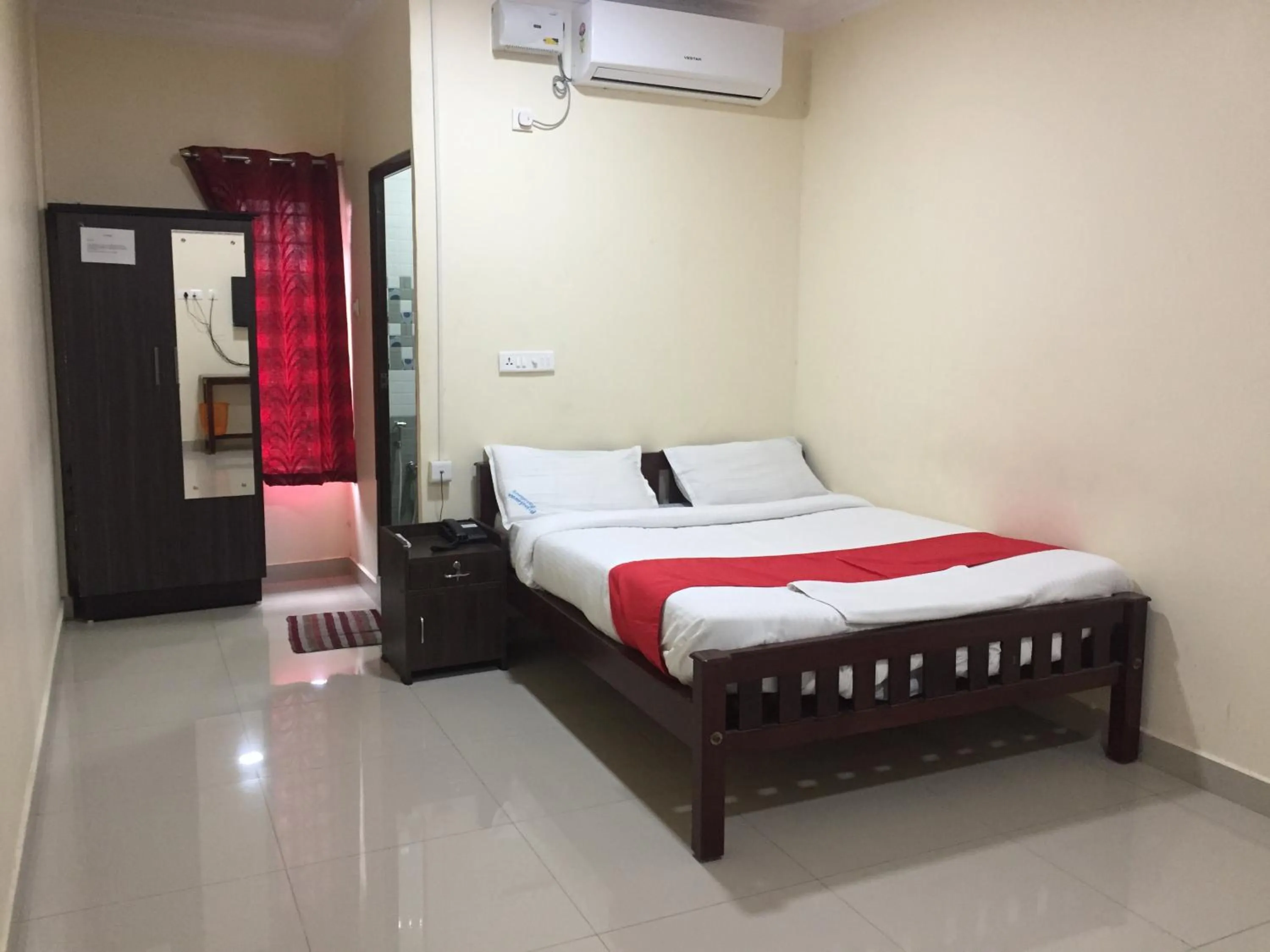 Photo of the whole room, Bed in Brindavan Residency