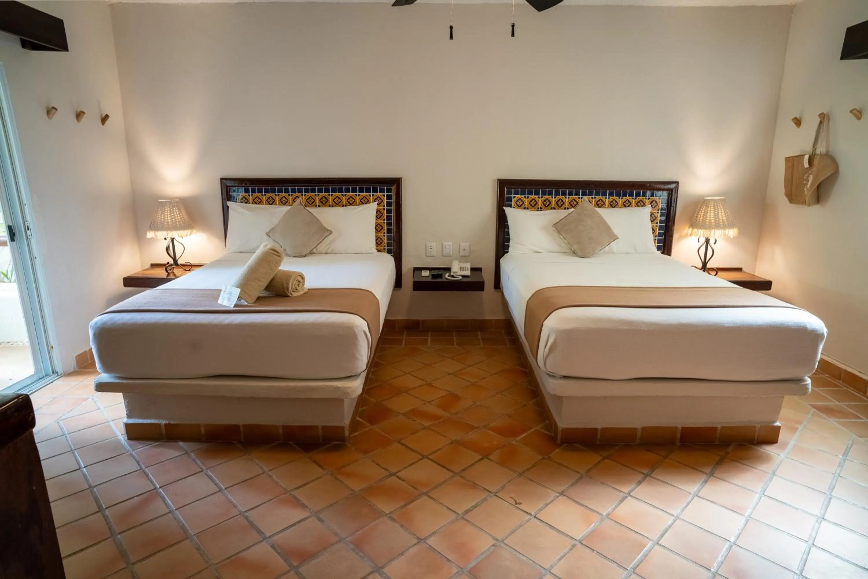 Bed in Petit Lafitte Beach Front Hotel & Bungalows