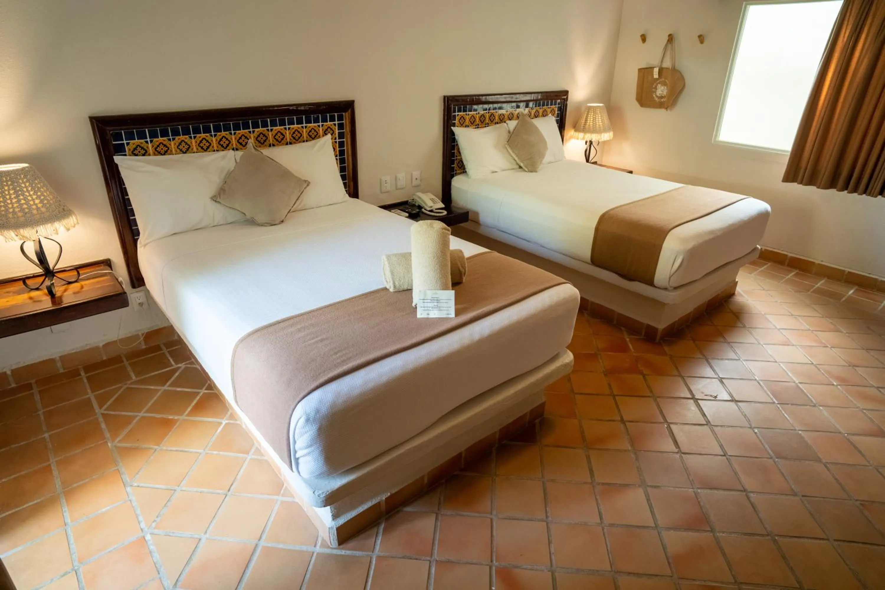 Bed in Petit Lafitte Beach Front Hotel & Bungalows