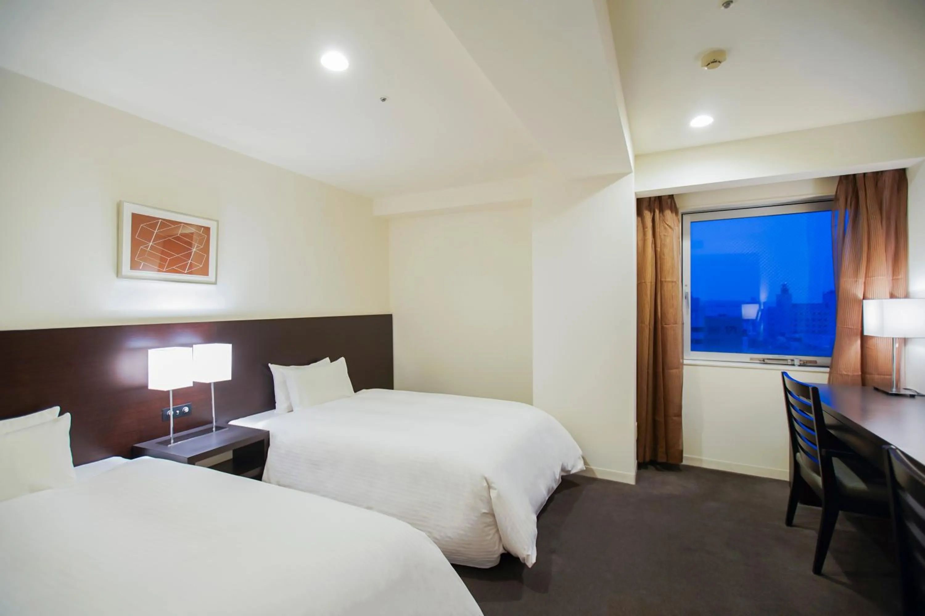 Bed in Hotel Sunroute Tokushima