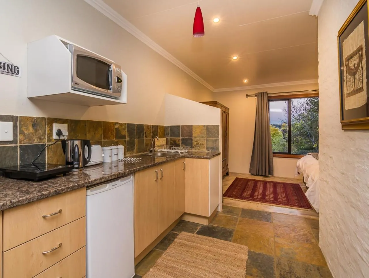 Kitchen or kitchenette in Moonflower Cottages