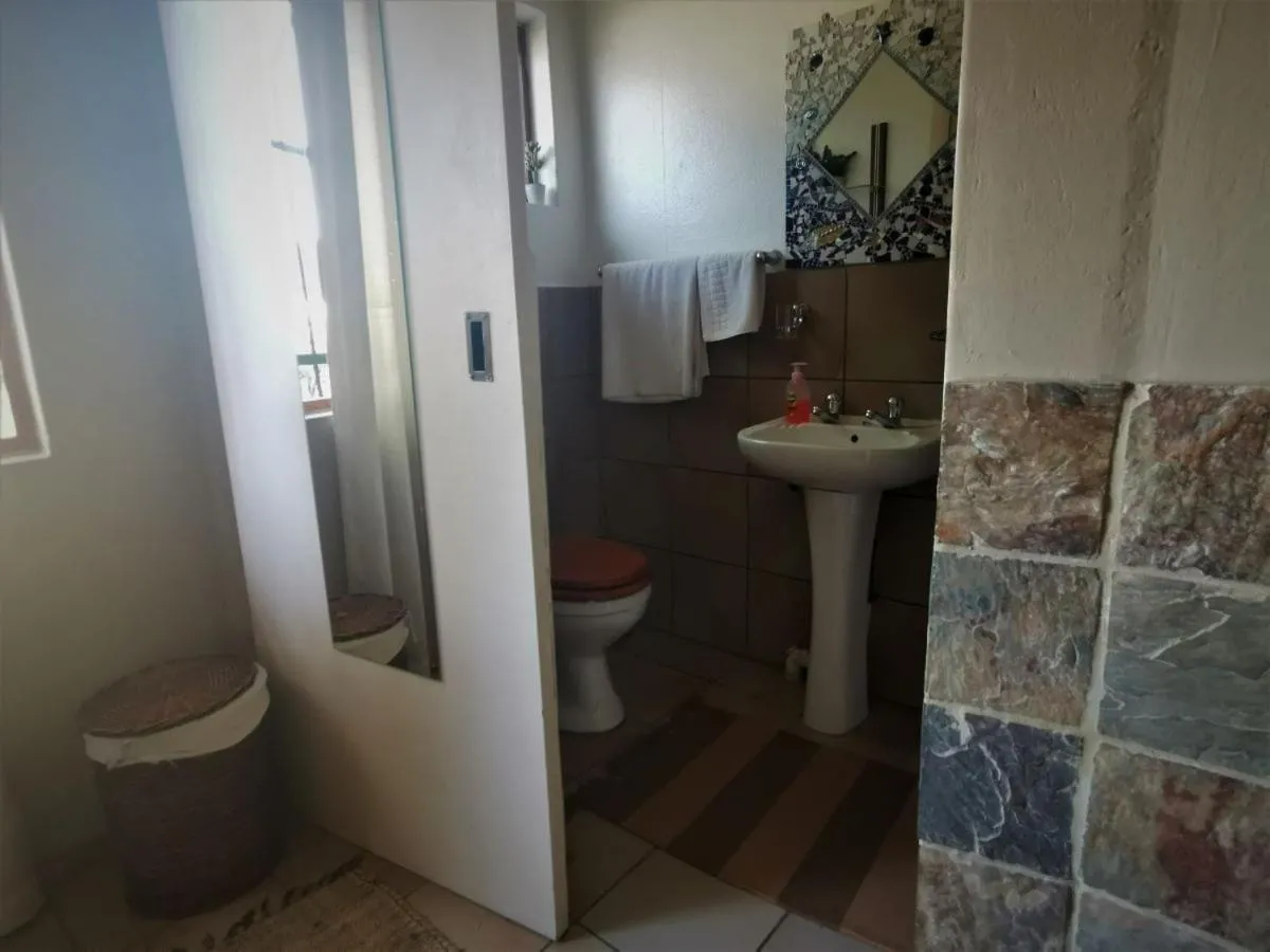 Toilet in Moonflower Cottages