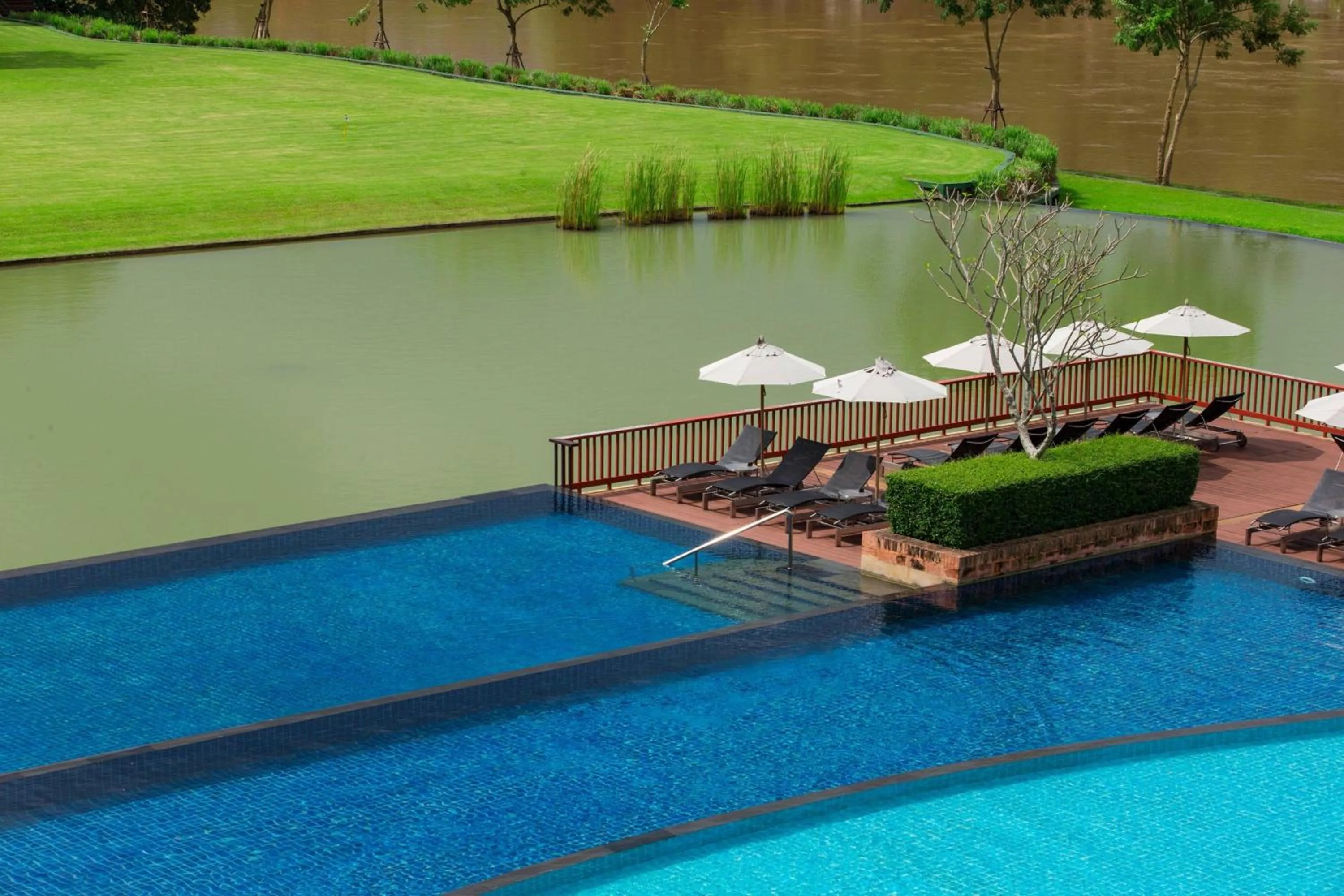 Swimming pool in Le Meridien Chiang Rai Resort, Thailand