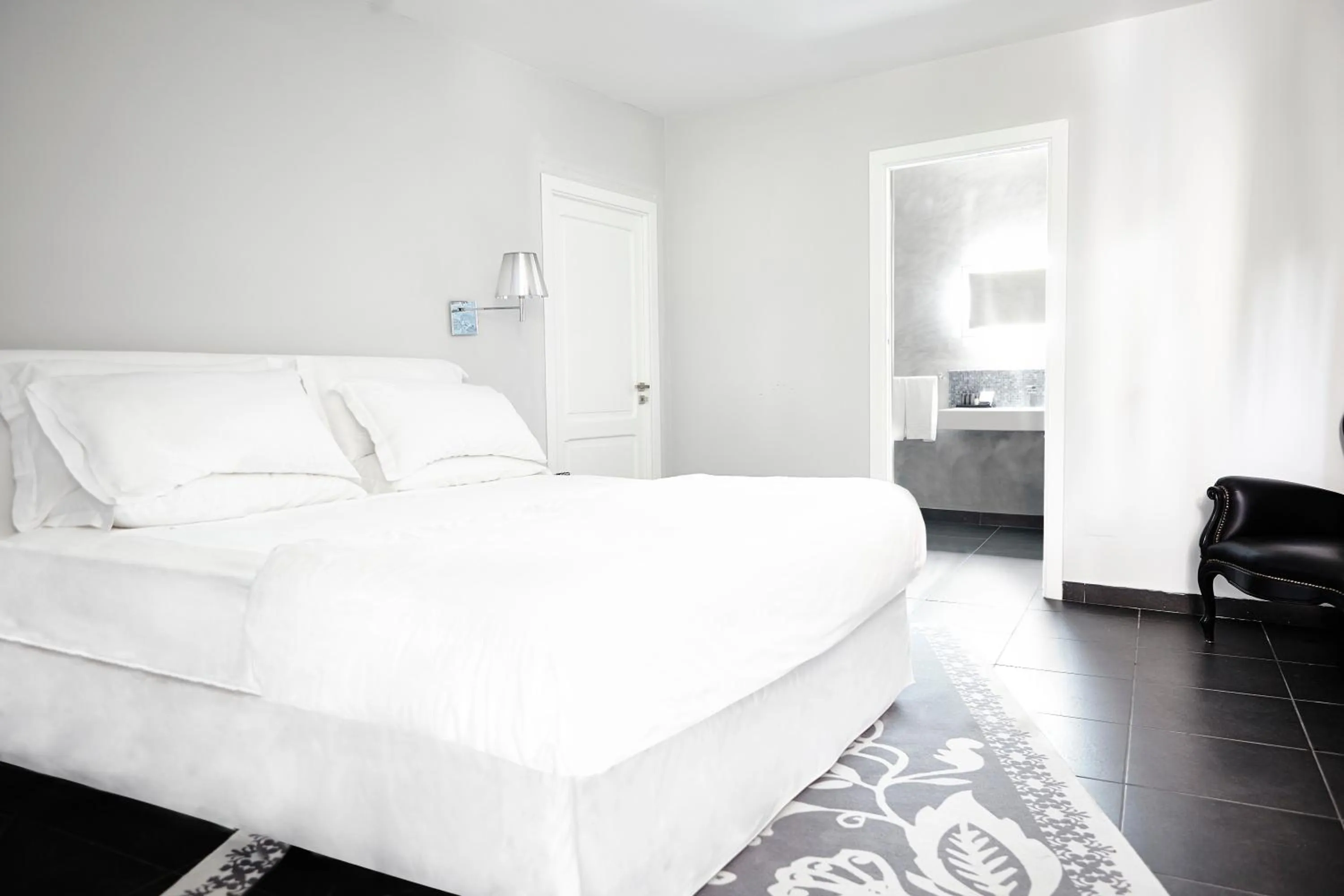 Bed in La Suite Boutique Hotel