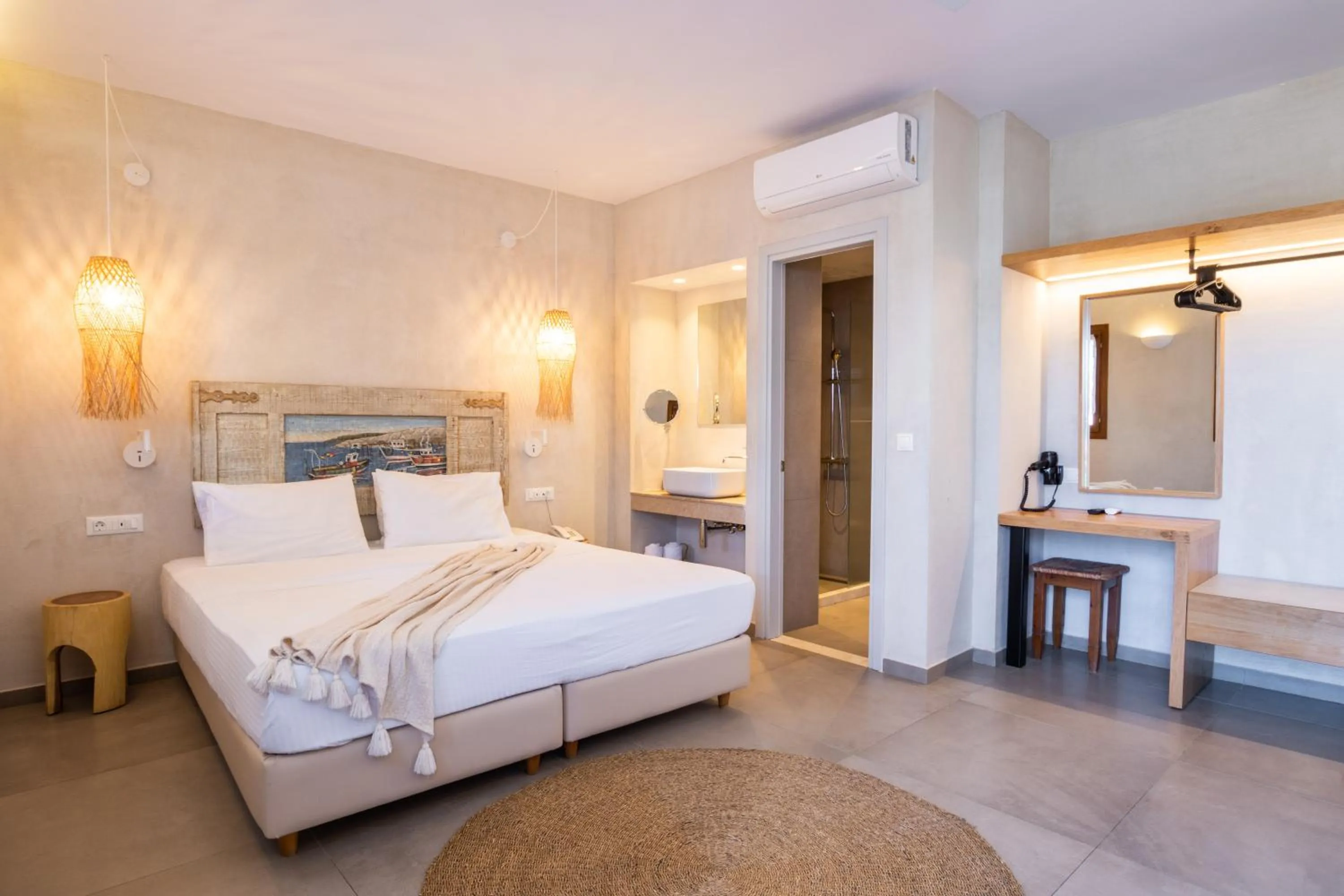 Bed in Aegean Village Beachfront Resort