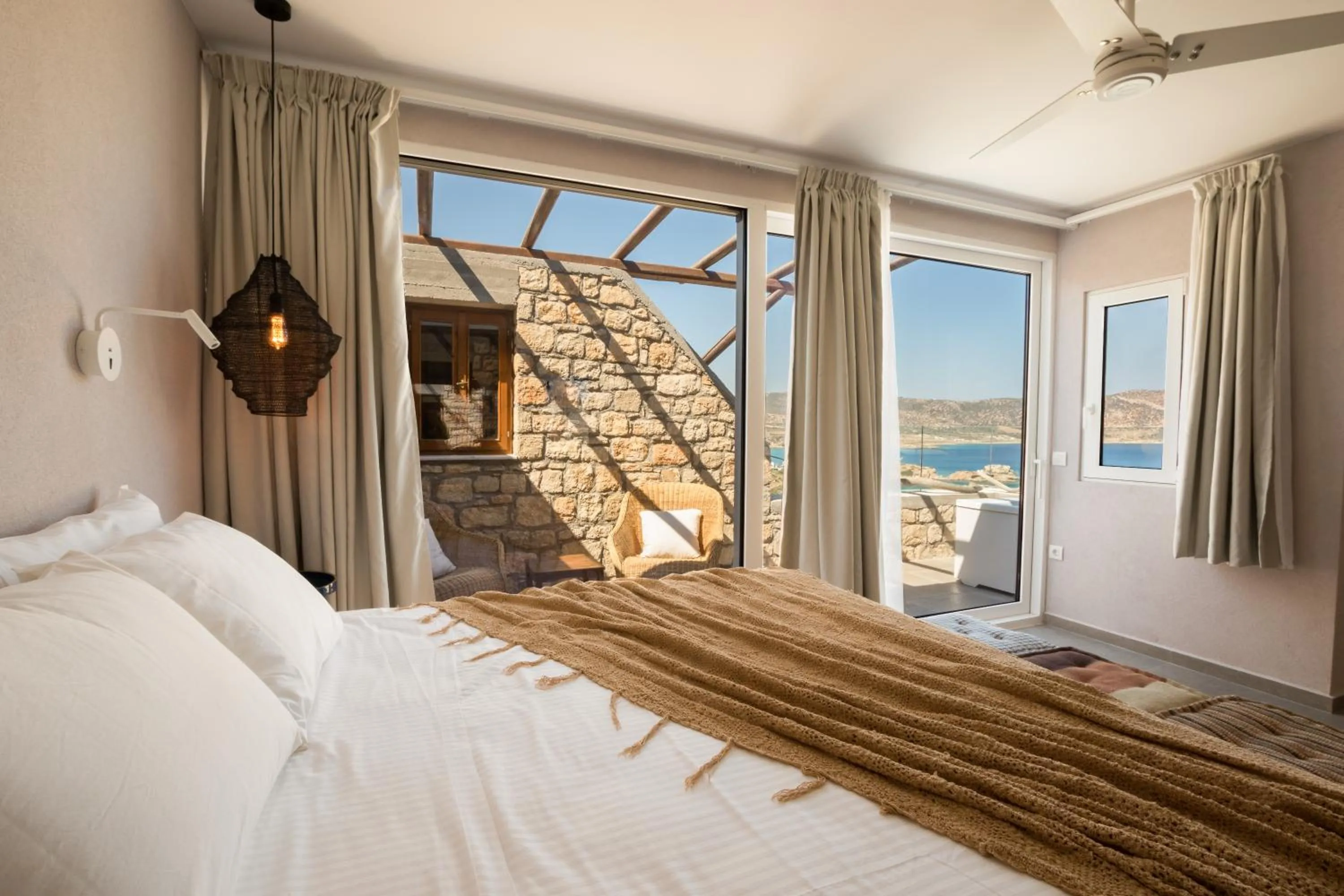 Bed in Aegean Village Beachfront Resort