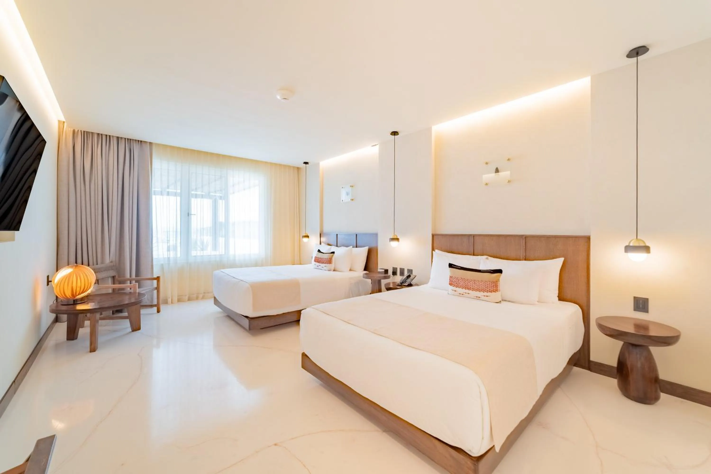 Photo of the whole room, Bed in Hotel Indigo La Paz Puerta Cortes by IHG