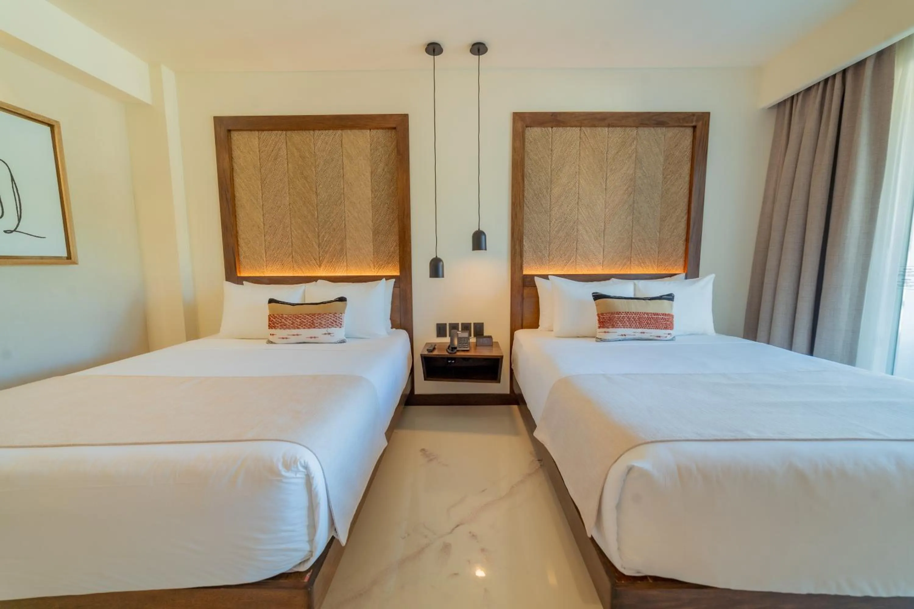 Bed in Hotel Indigo La Paz Puerta Cortes by IHG