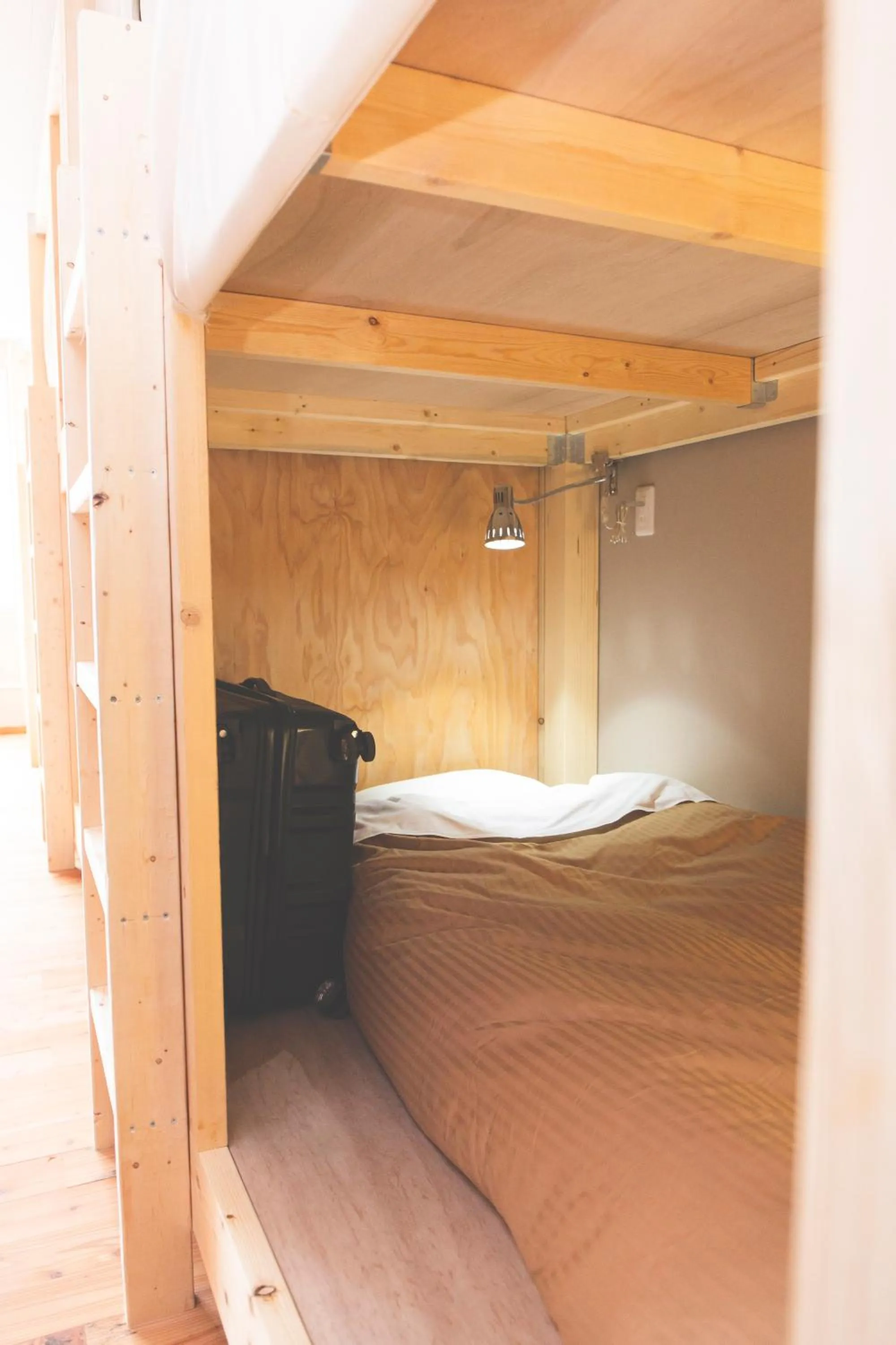 Photo of the whole room, Bed in Noboribetsu Guest House AKA & AO