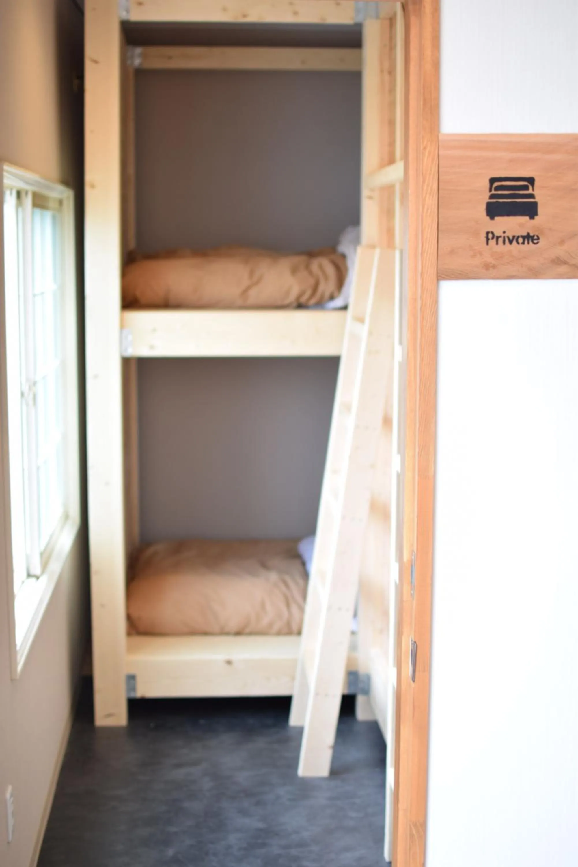 Photo of the whole room, Bed in Noboribetsu Guest House AKA & AO