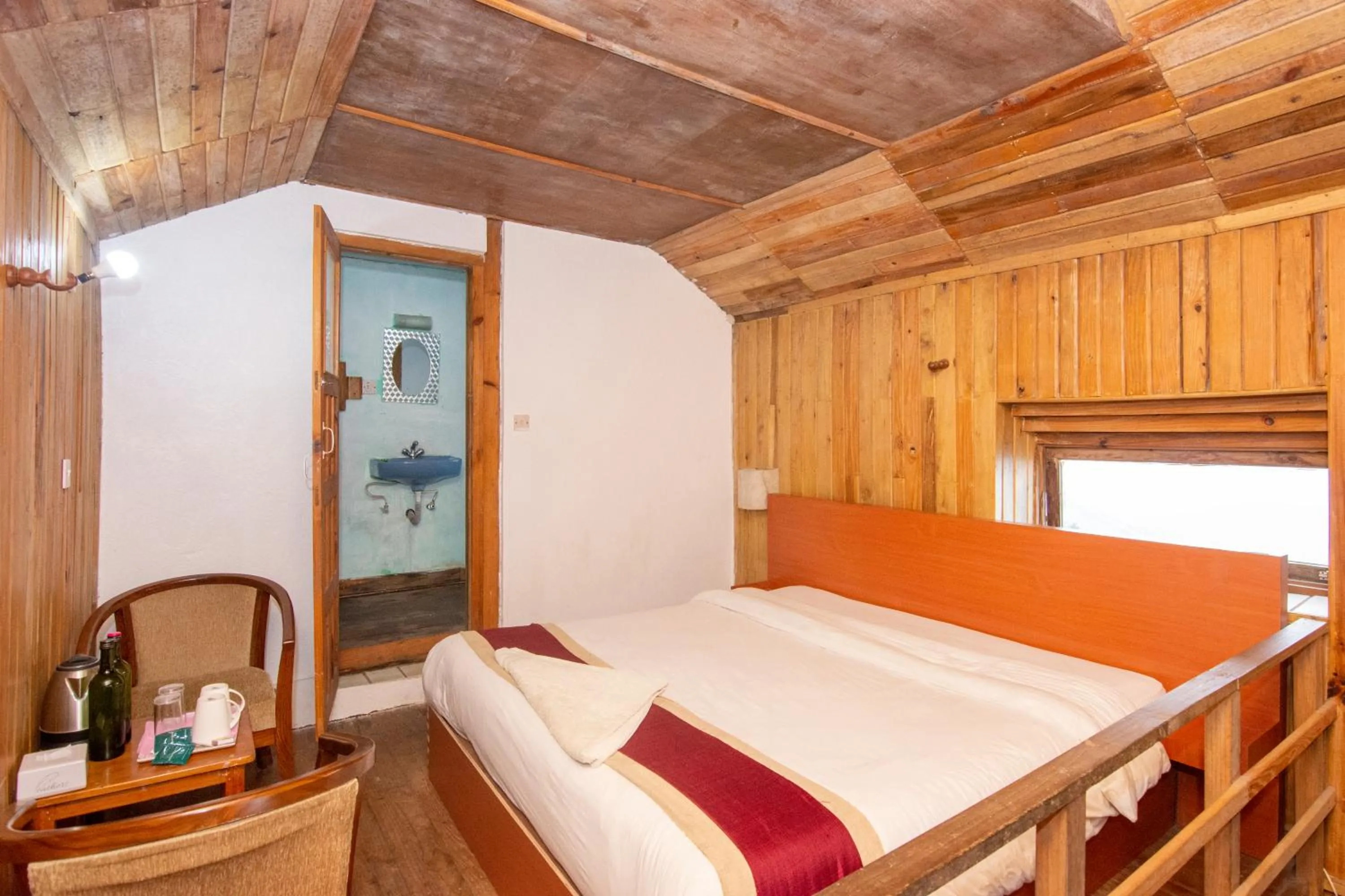 Photo of the whole room, Bed in Everest Manla Resort