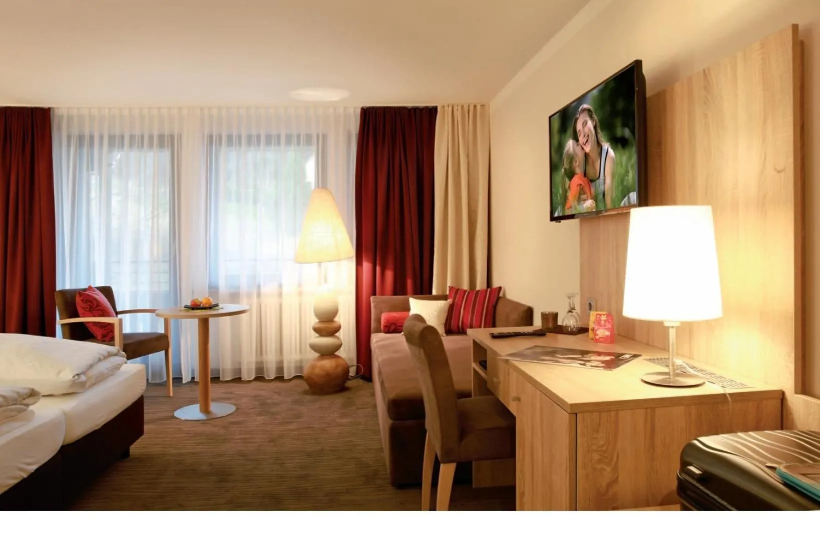 Seating area, Bed in Hotel Schwarzwaldhof