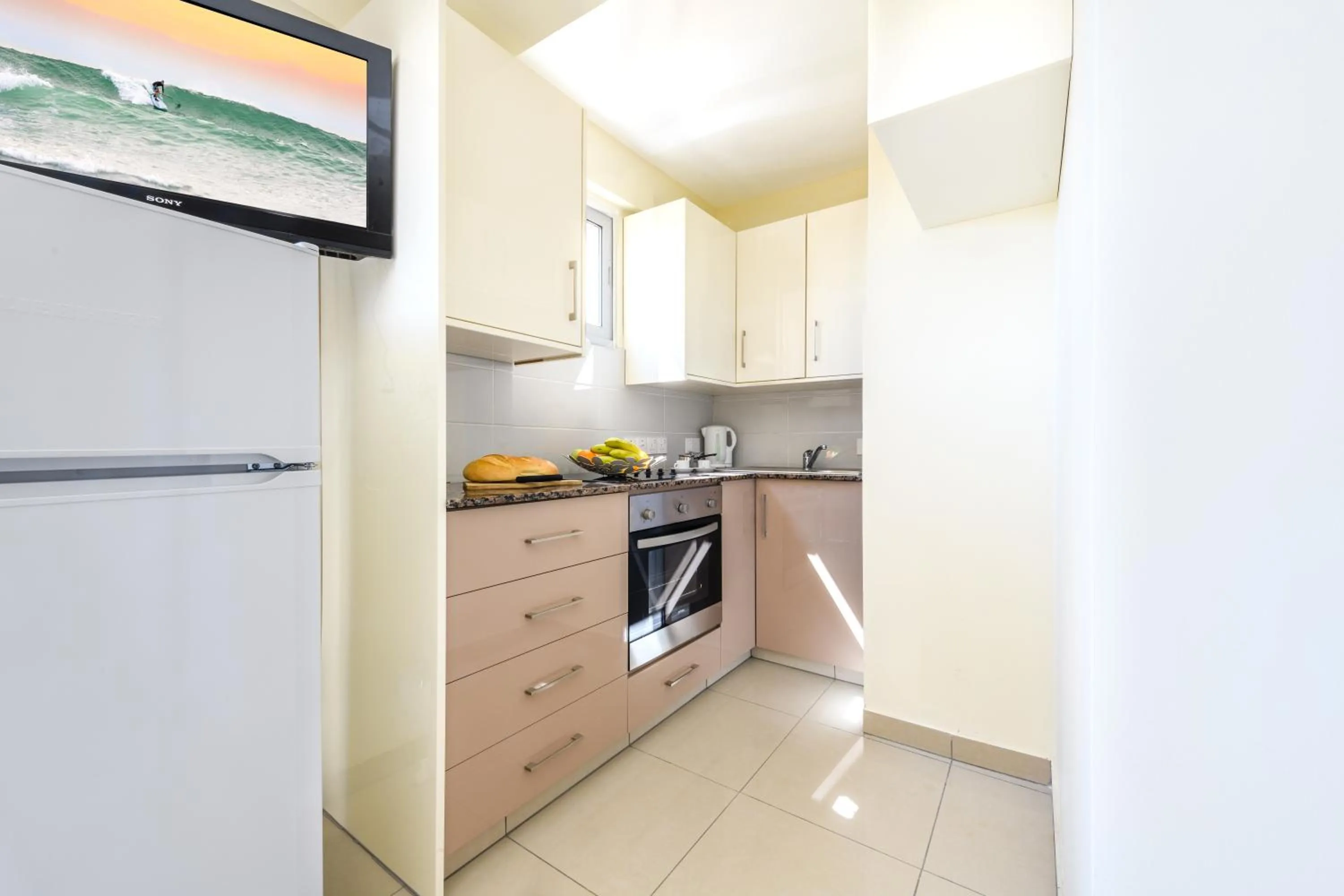 Kitchen or kitchenette in Kama Lifestyle Apartments