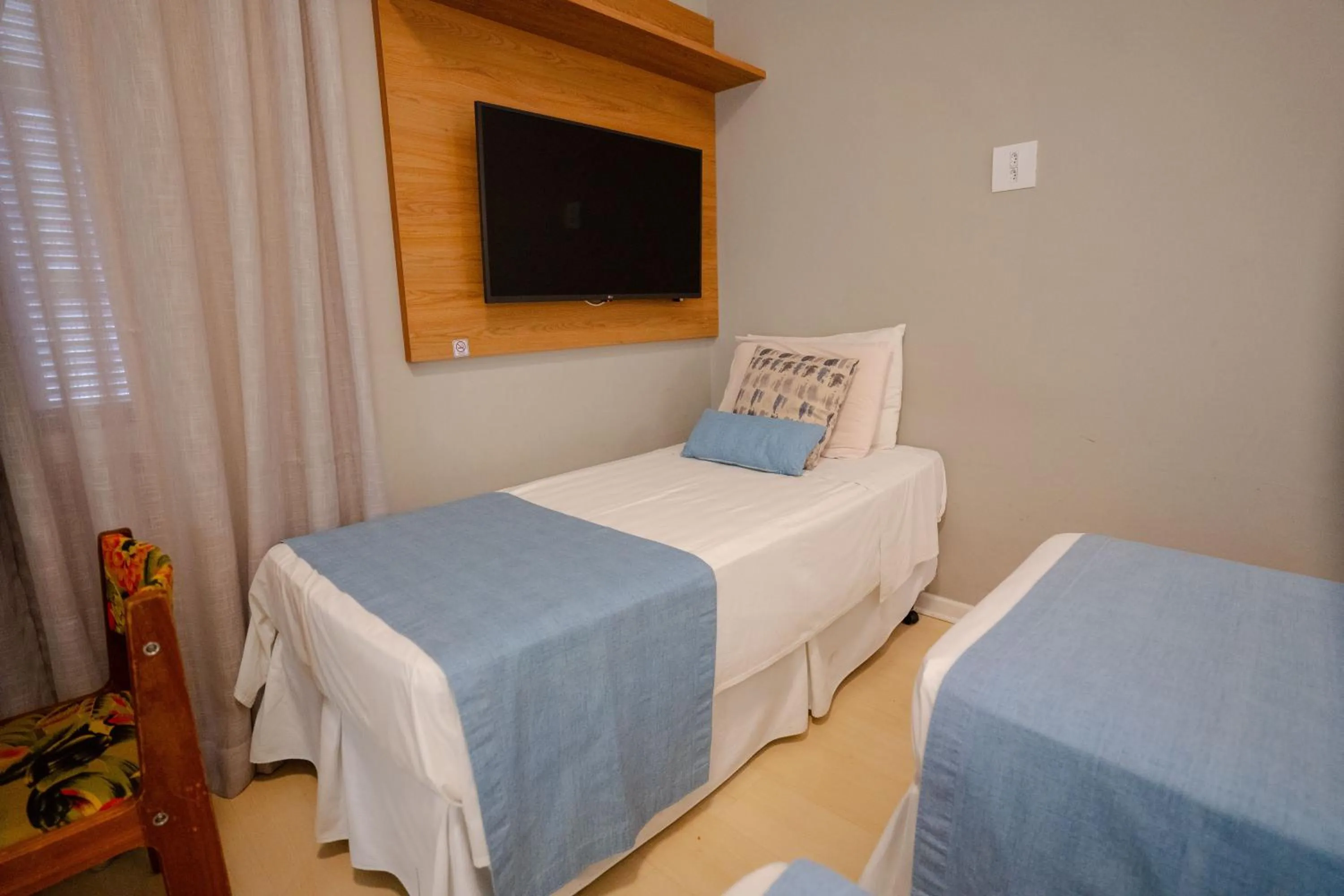 Bed in Hotel Minas Gerais