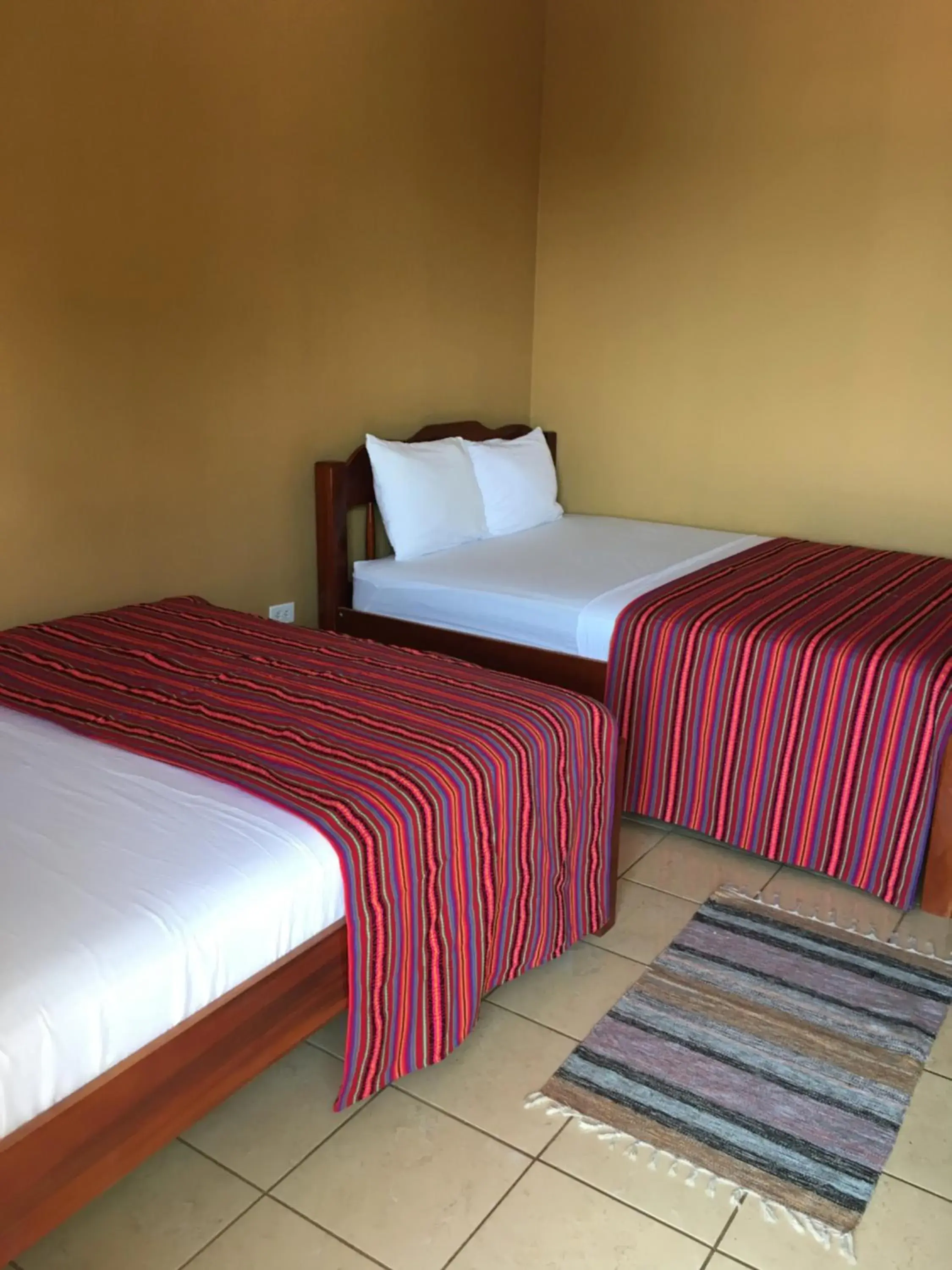 Bed in Ambergris Sunset Hotel Bed in Ambergris Sunset Hotel