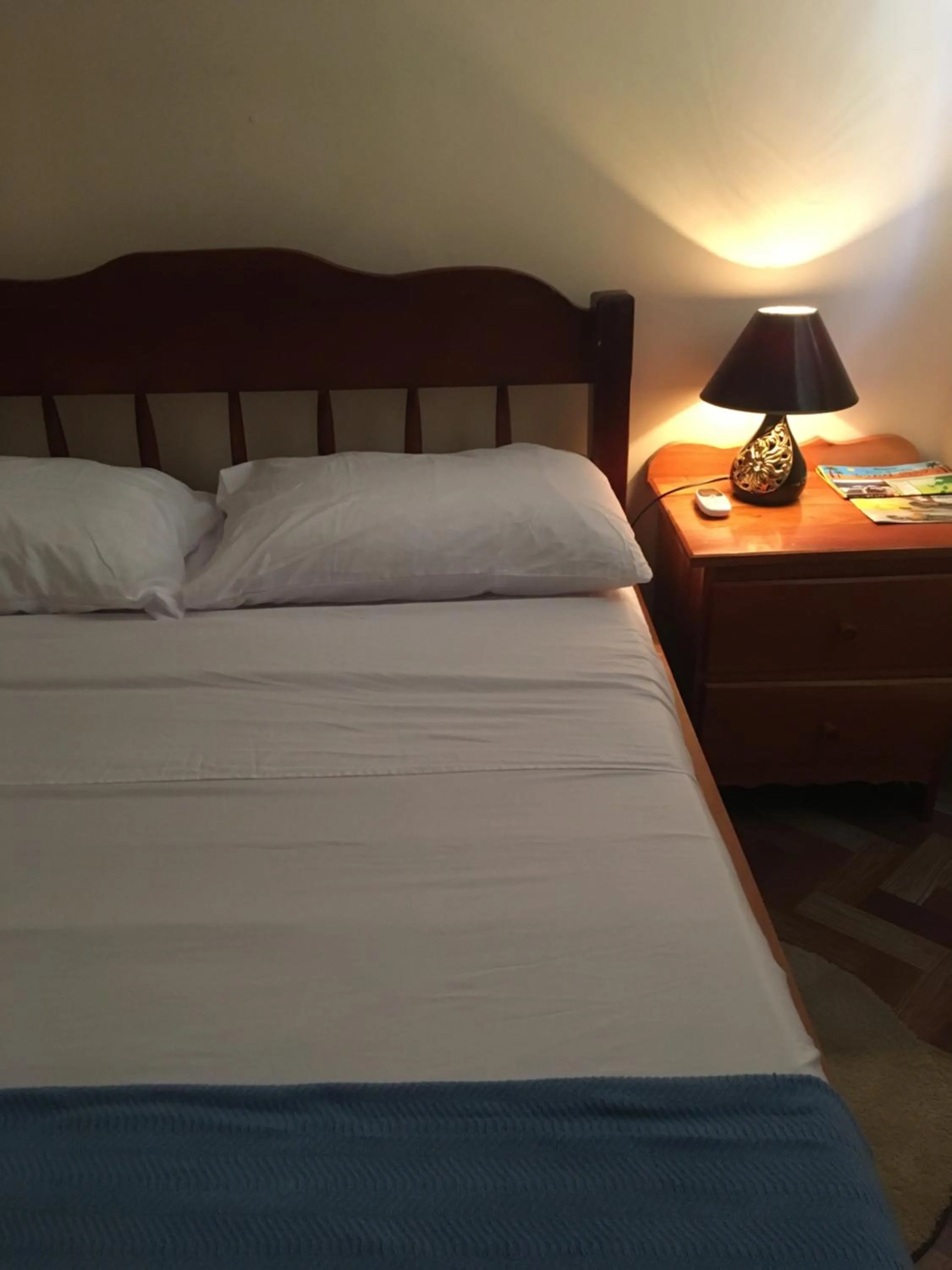 Bed in Ambergris Sunset Hotel