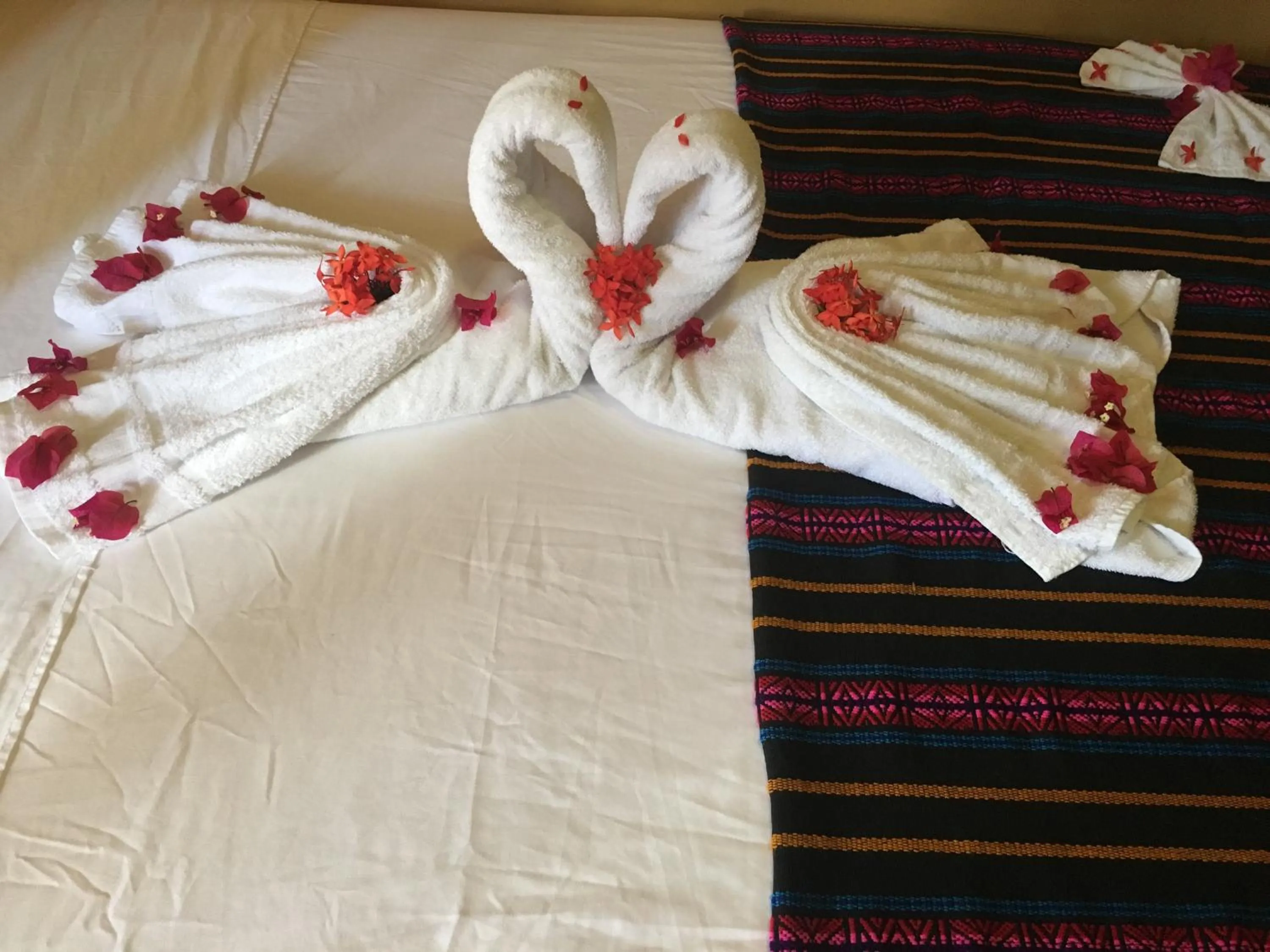 Bed in Ambergris Sunset Hotel