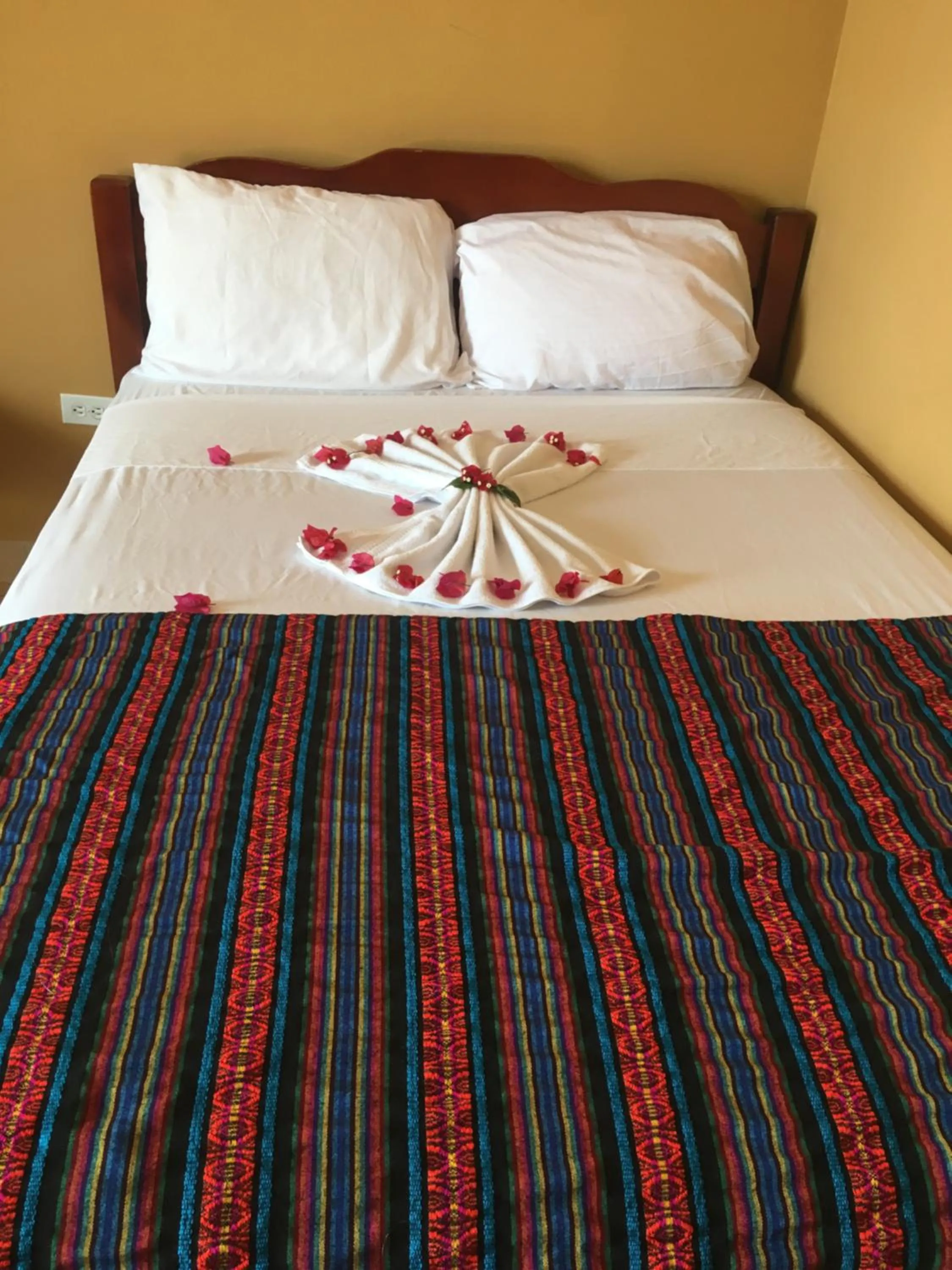 Bed in Ambergris Sunset Hotel