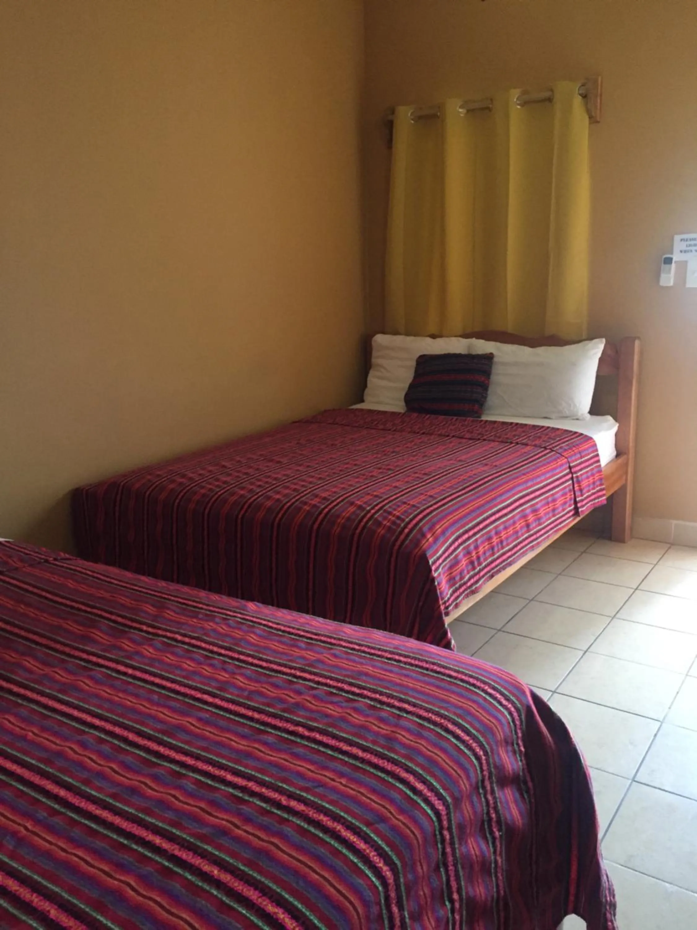 Bed in Ambergris Sunset Hotel