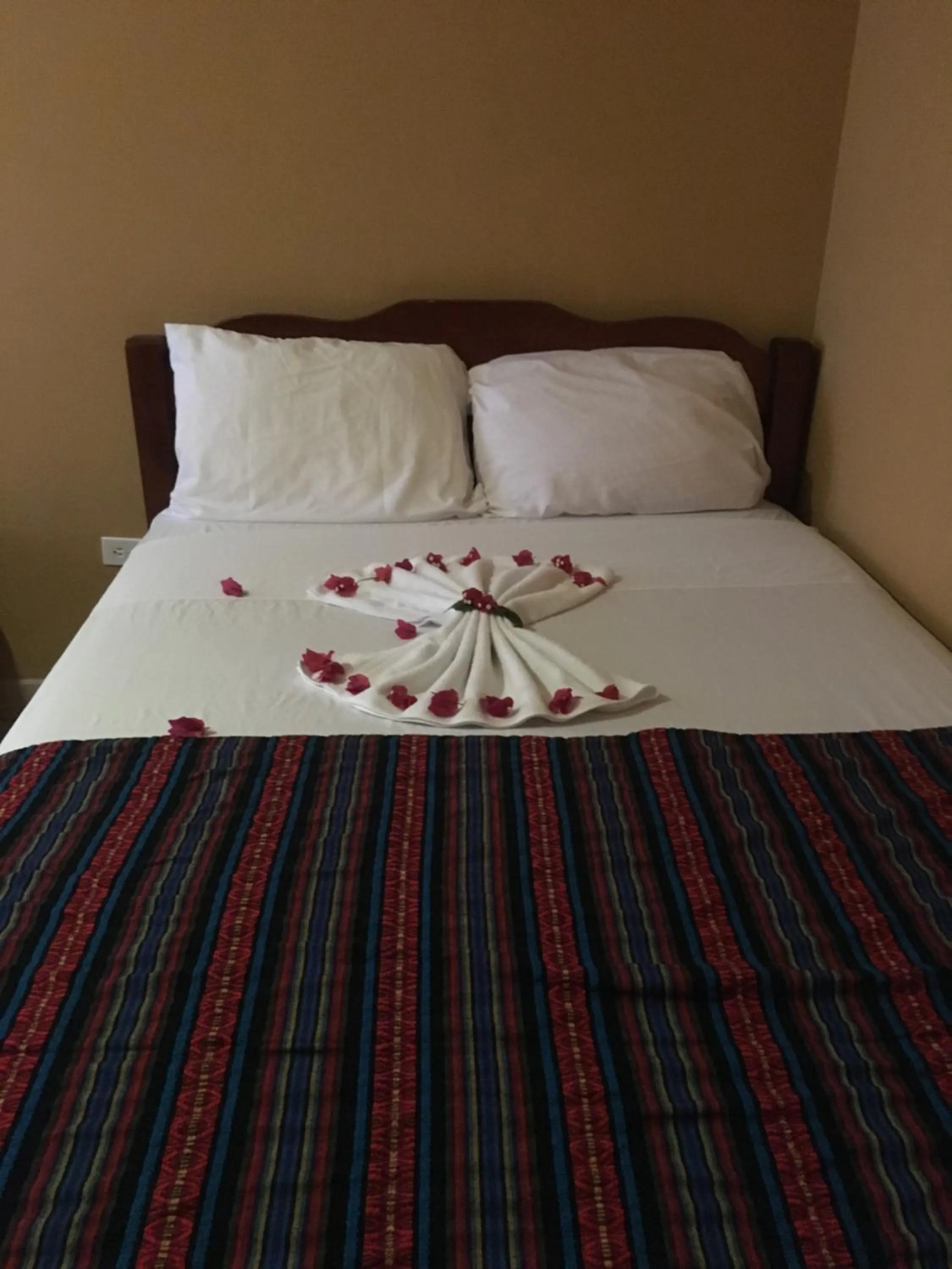 Bed in Ambergris Sunset Hotel