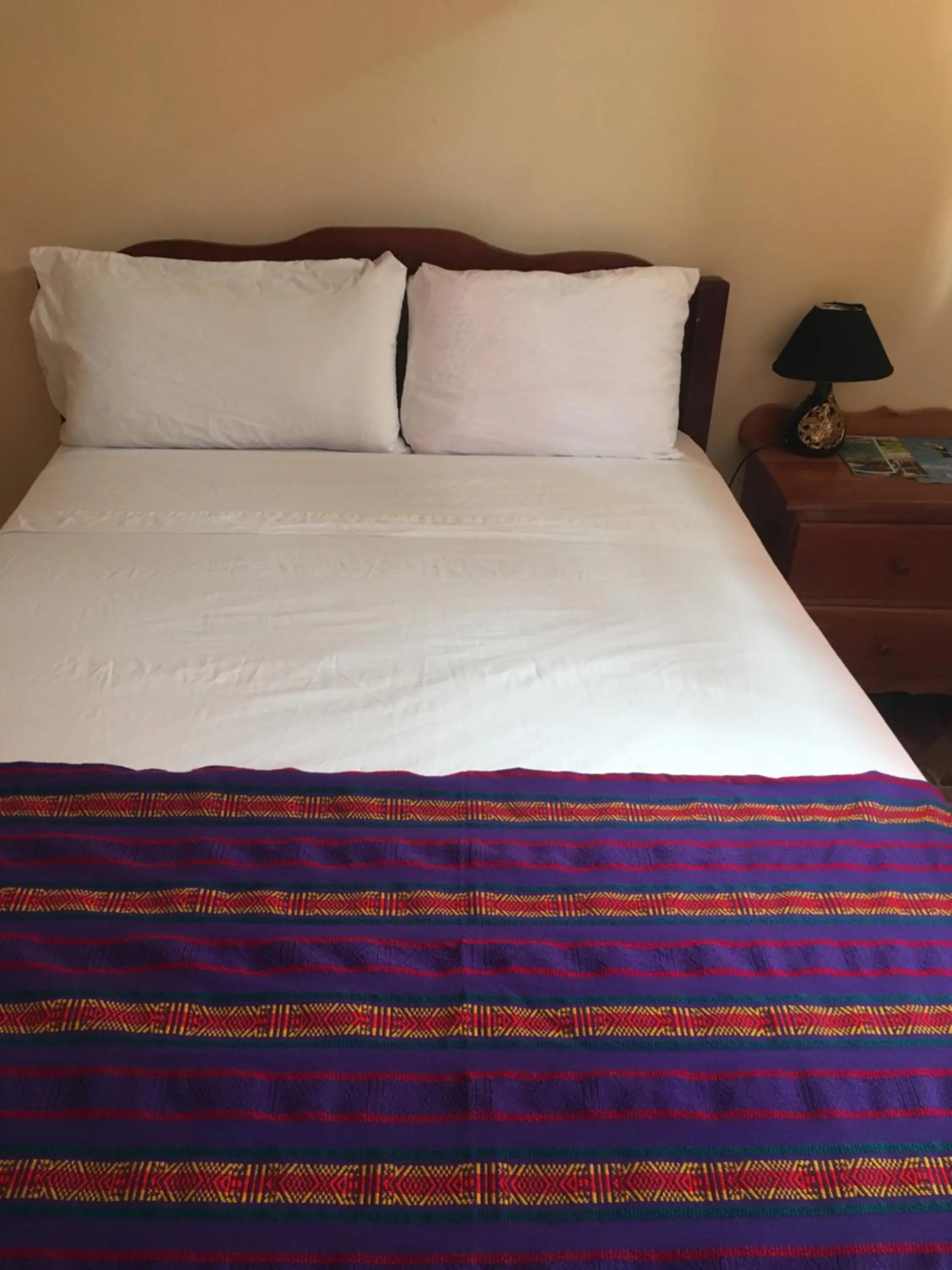 Bed in Ambergris Sunset Hotel