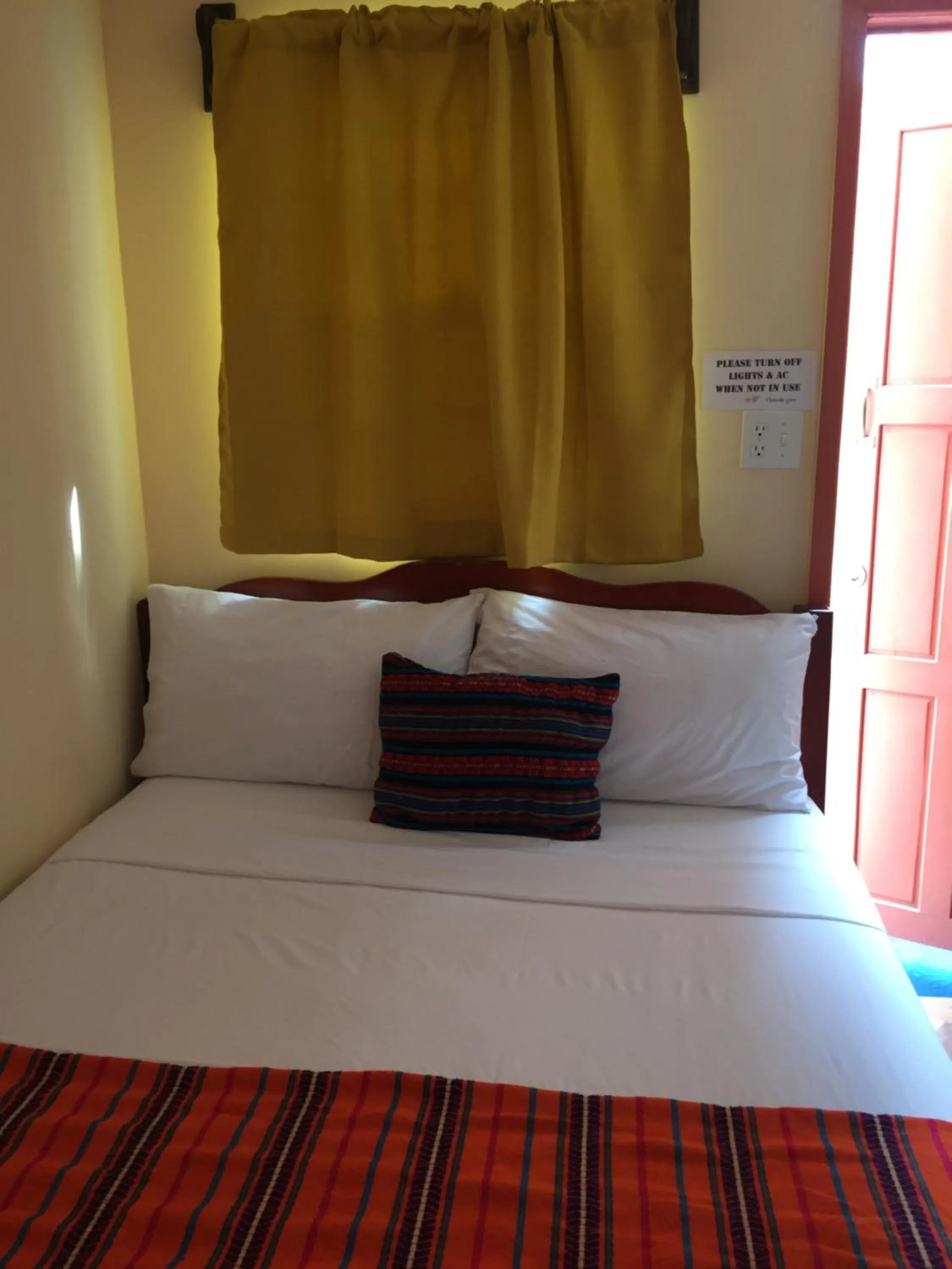 Bed in Ambergris Sunset Hotel