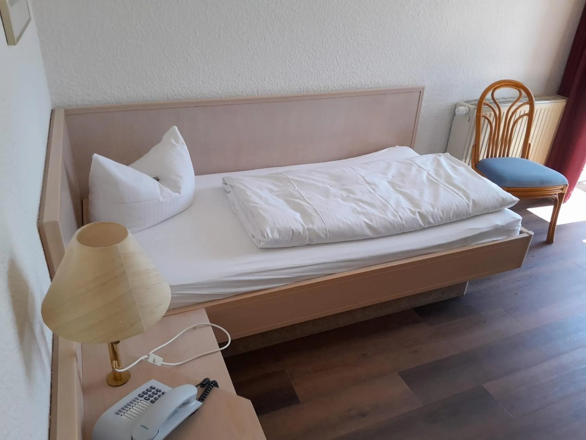 Photo of the whole room, Bed in Hotel Aichtaler Hof