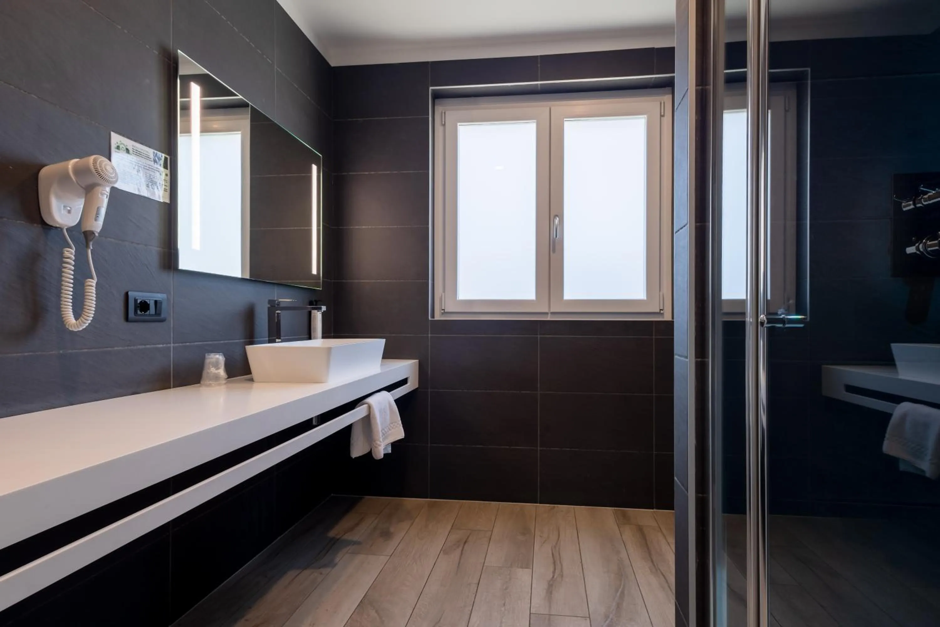 Bathroom in Aurora ApartHotel