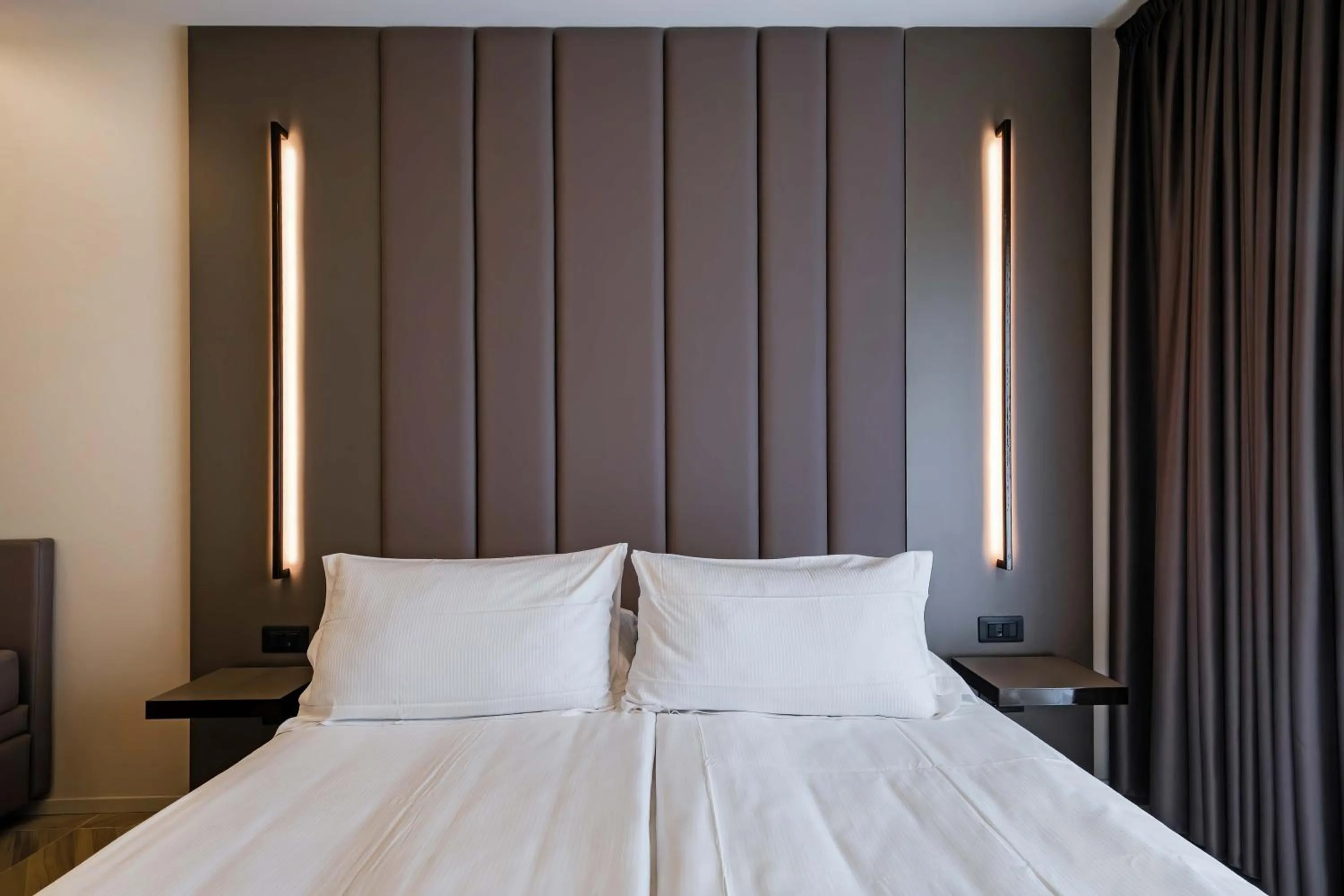 Bed in Aurora ApartHotel