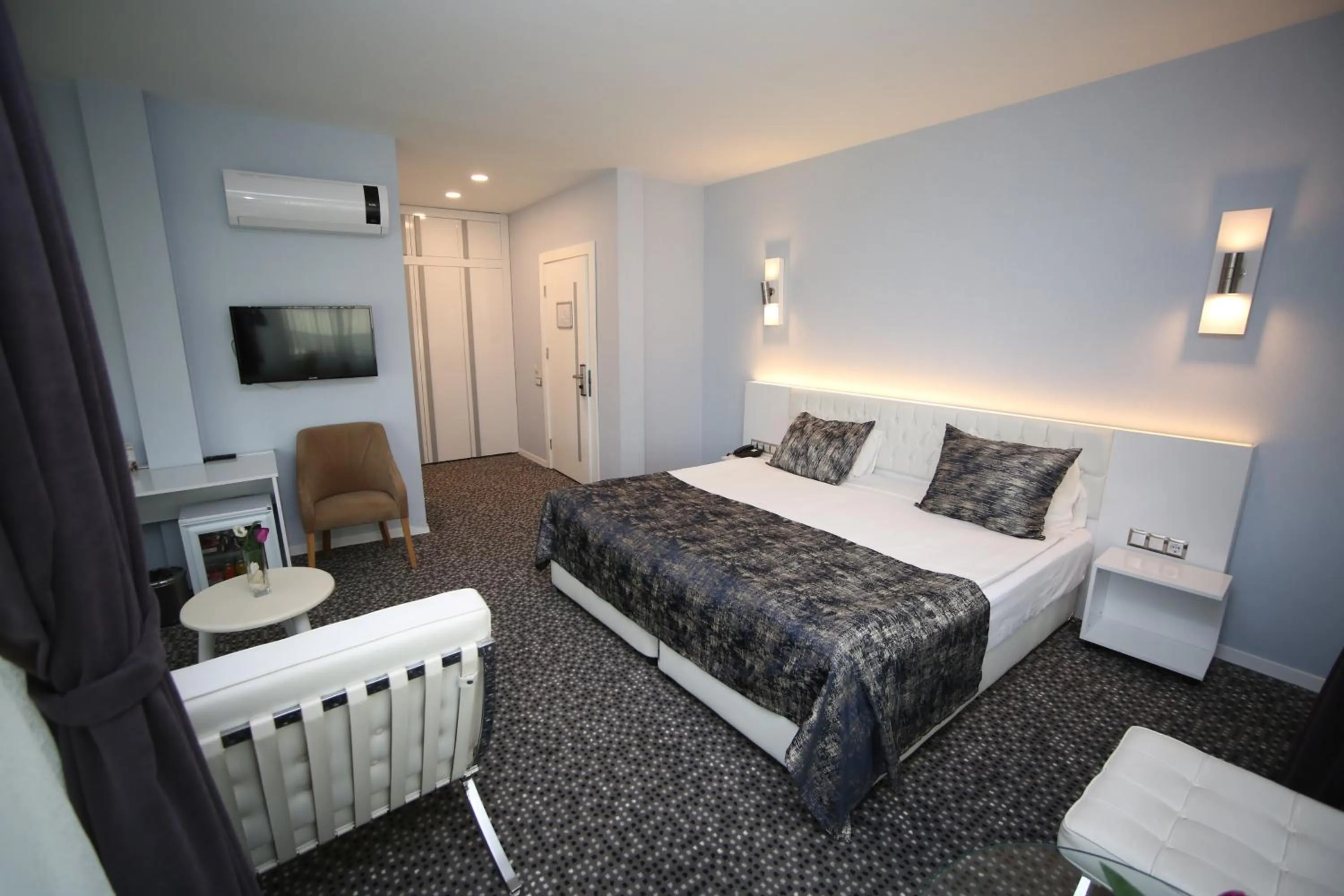 Bed in Grand Nora Hotel