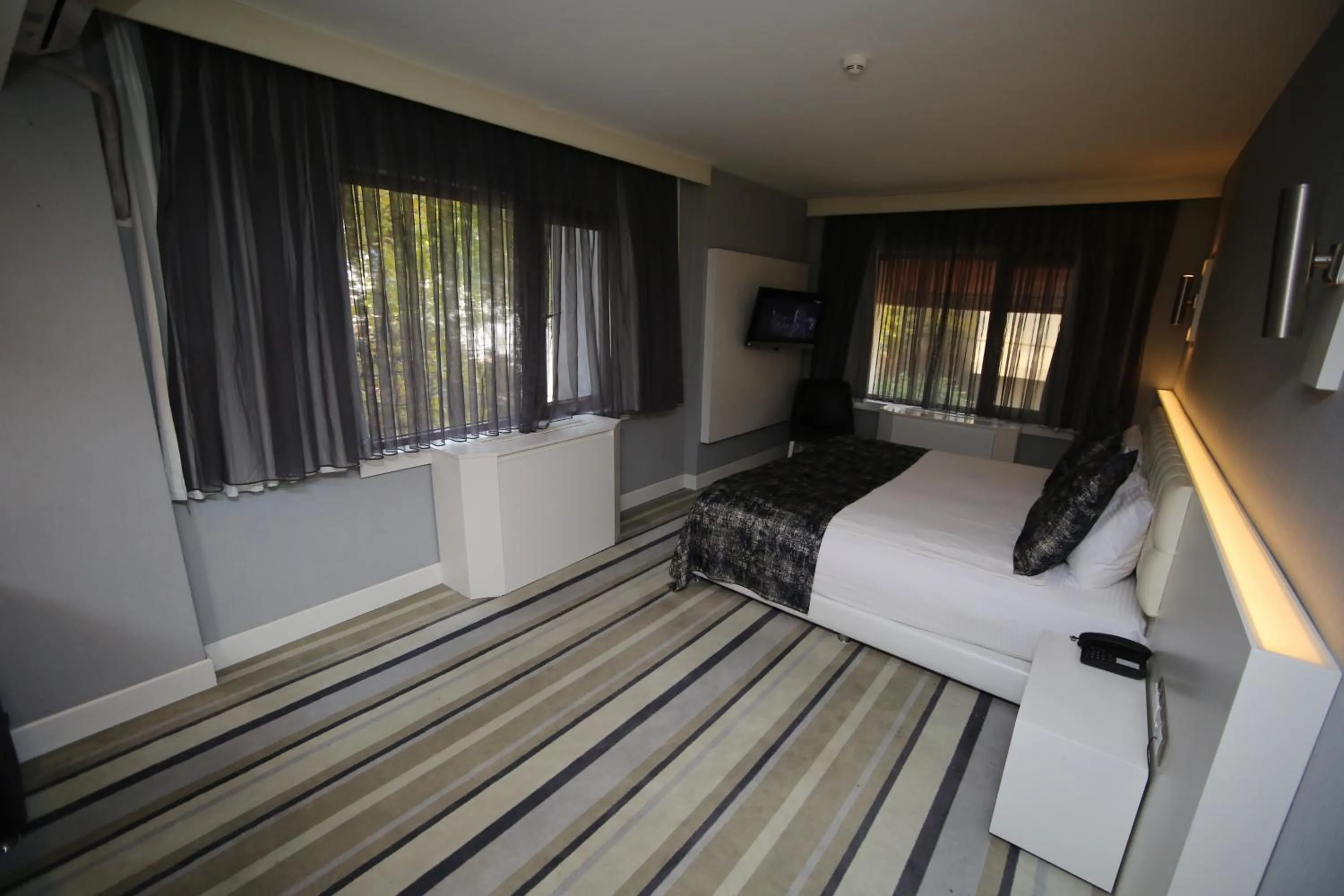 Bed in Grand Nora Hotel