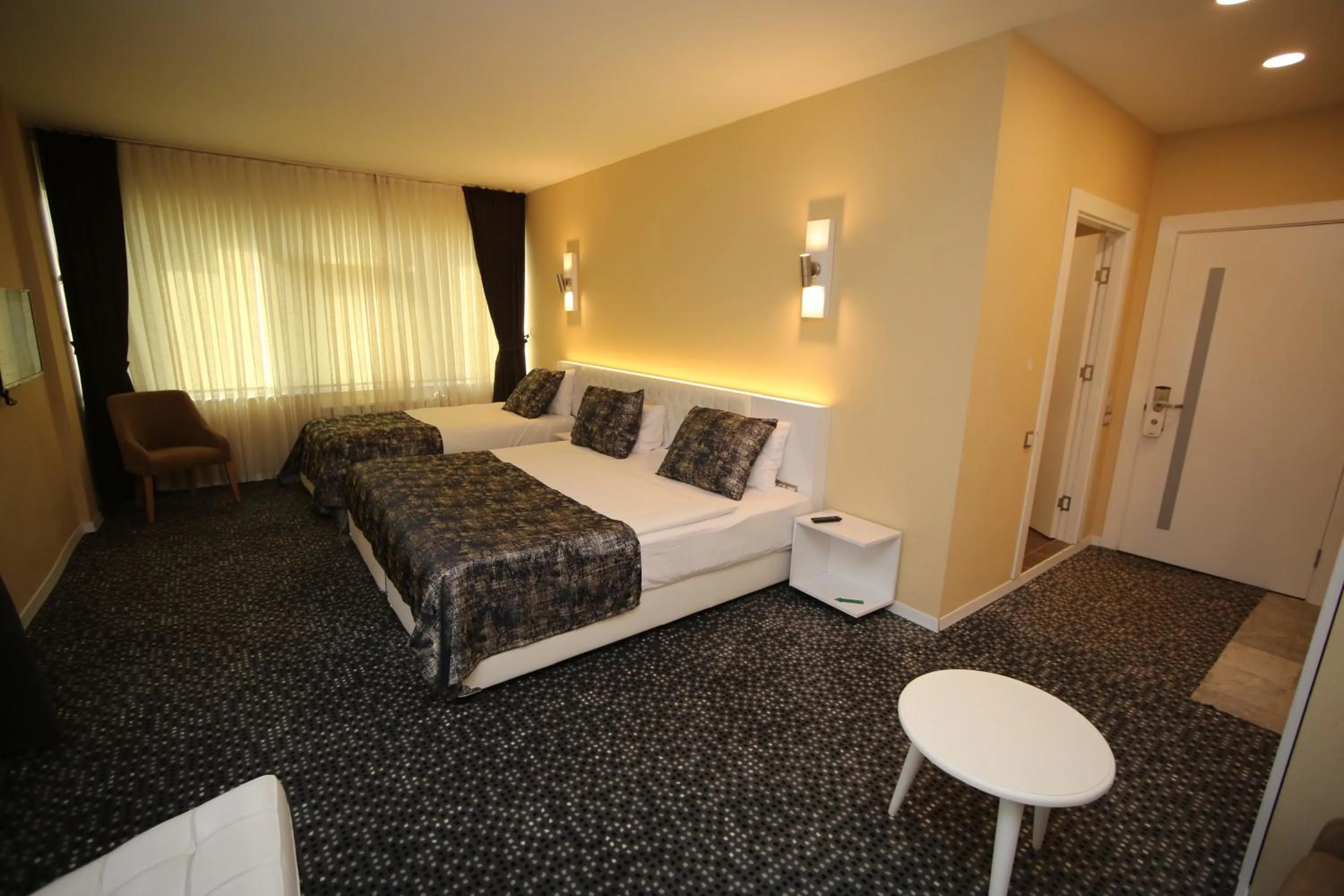 Bed in Grand Nora Hotel