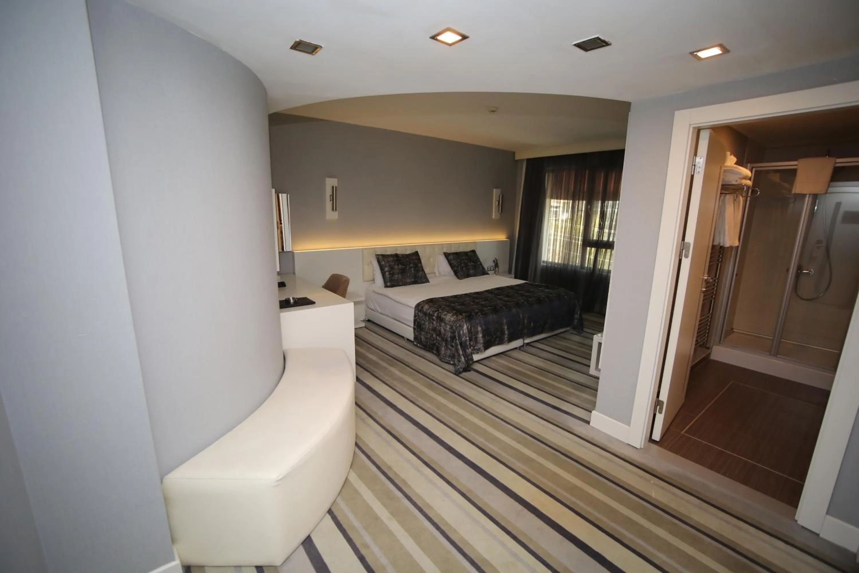 Bed in Grand Nora Hotel