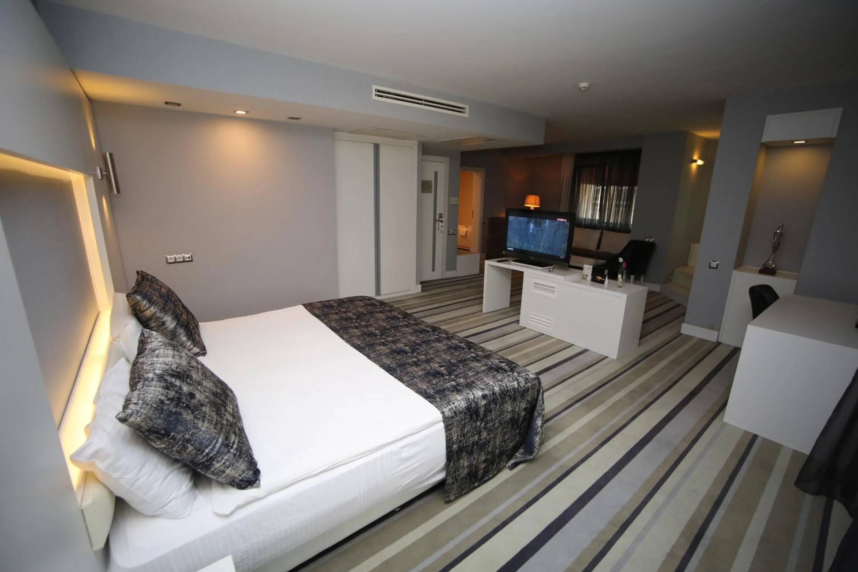 Bed in Grand Nora Hotel