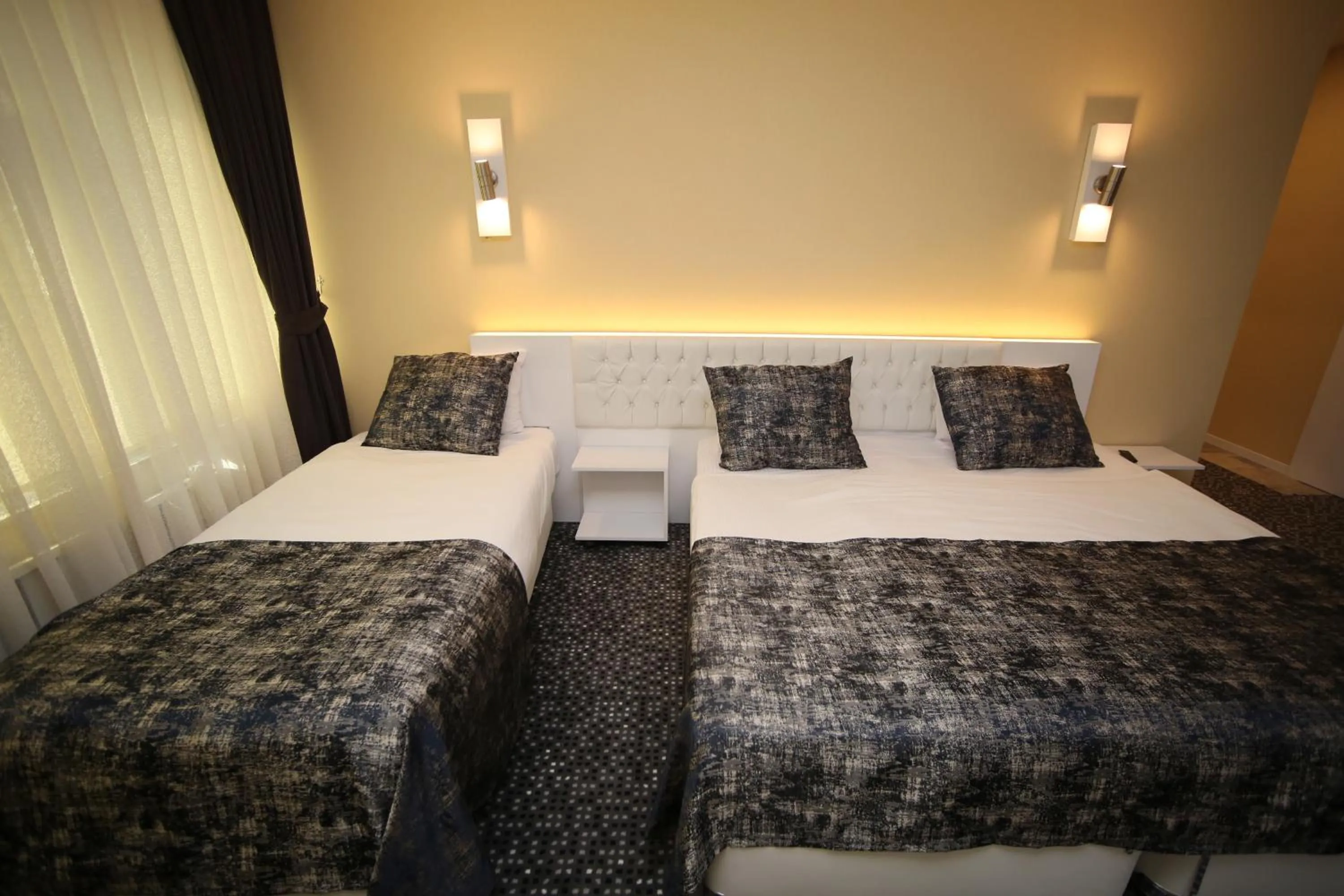 Bed in Grand Nora Hotel