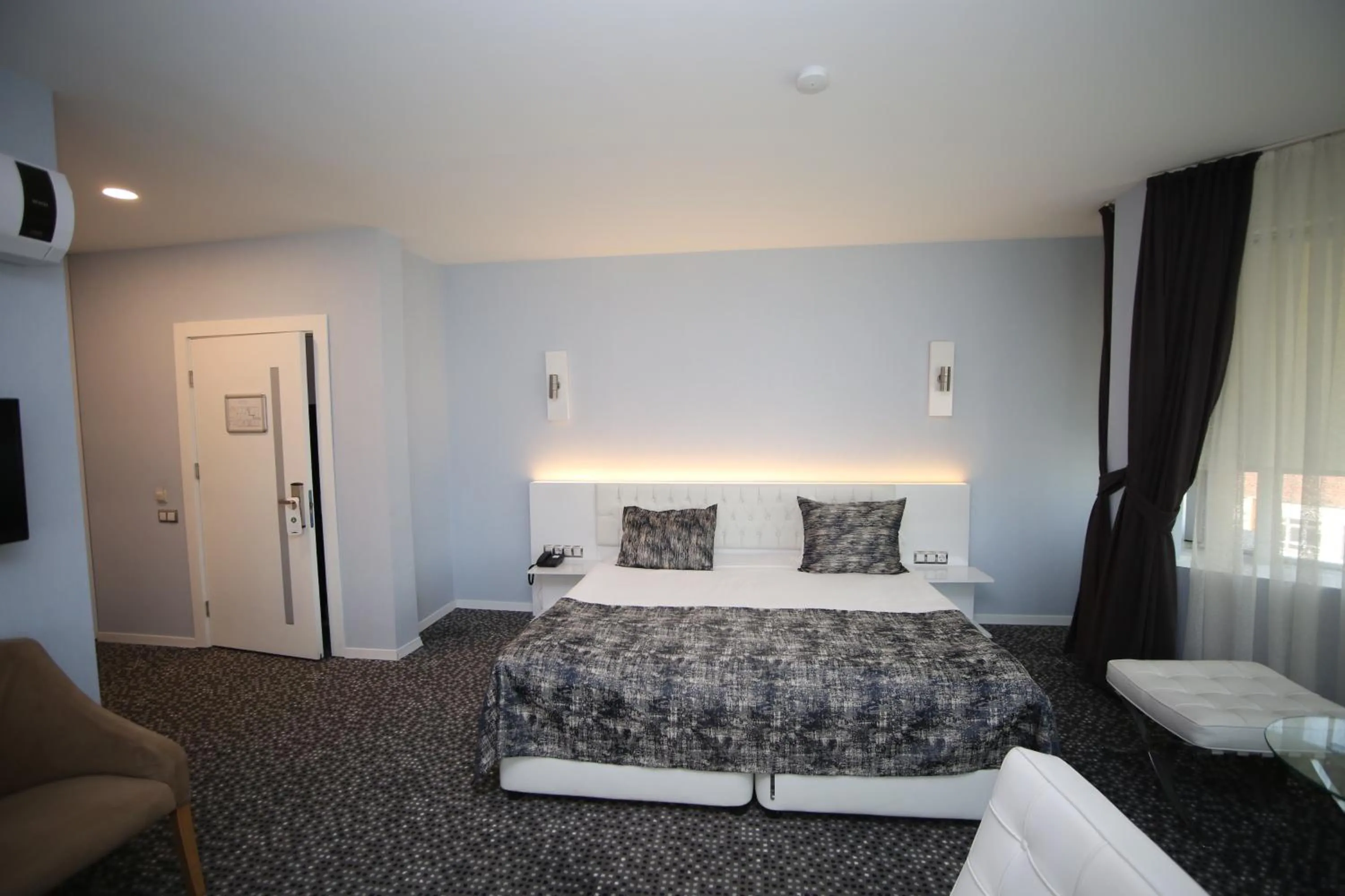 Bed in Grand Nora Hotel