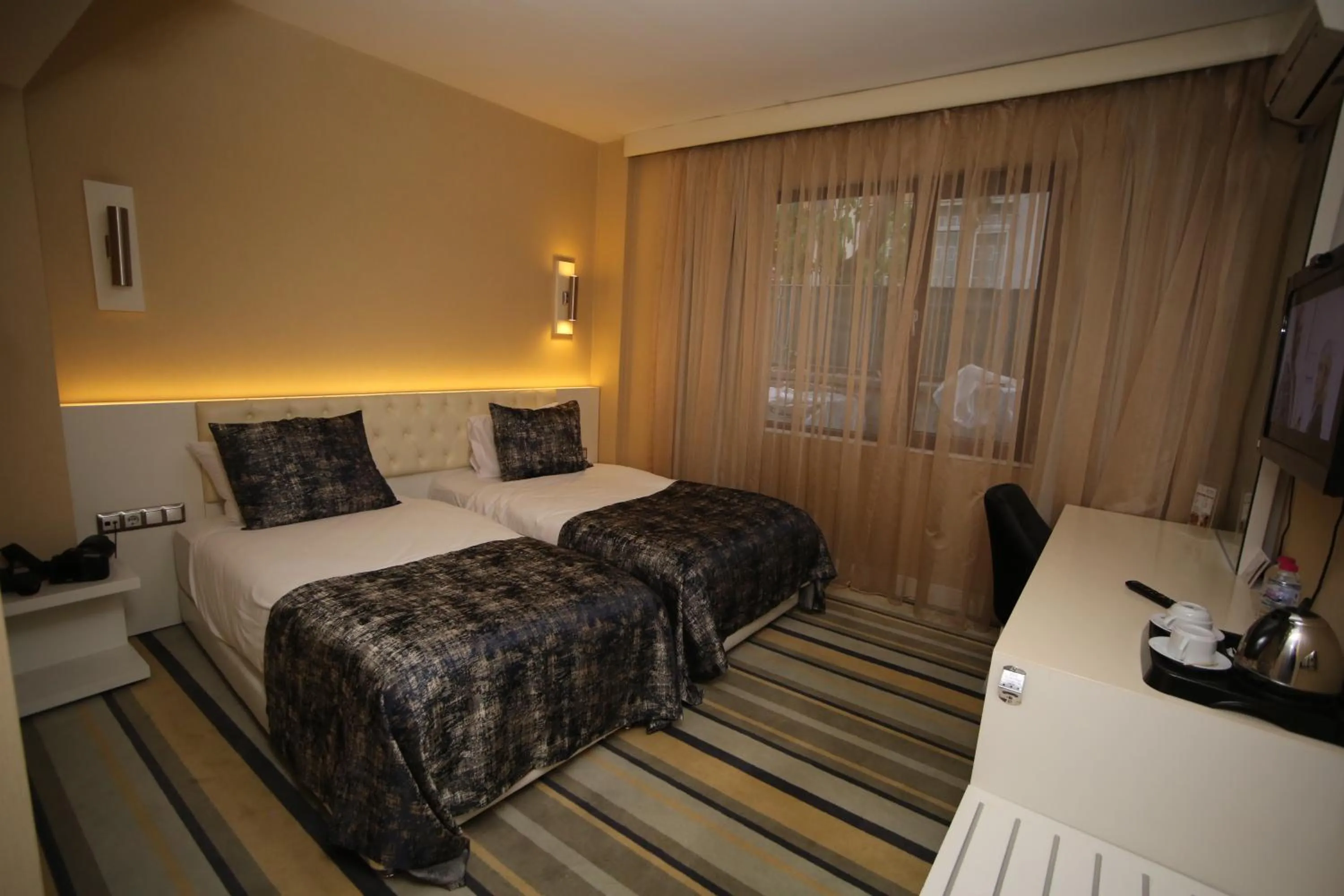 Bed in Grand Nora Hotel