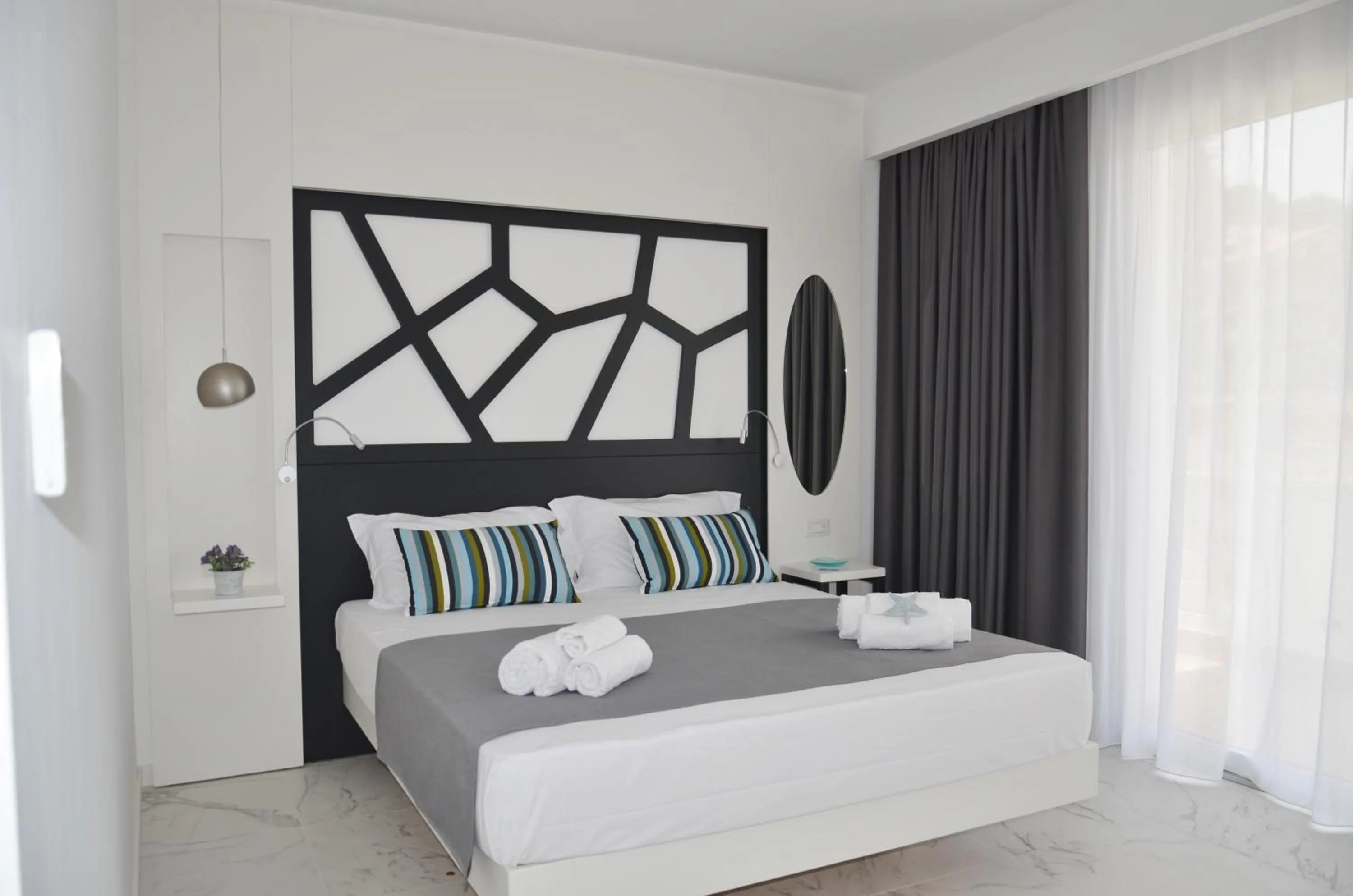 Bed in Centurio luxury rooms