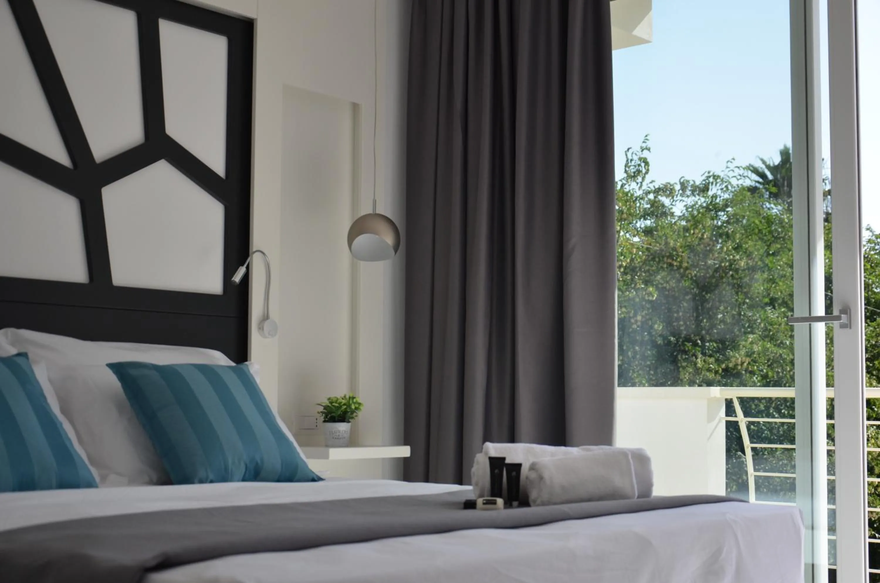Bed in Centurio luxury rooms